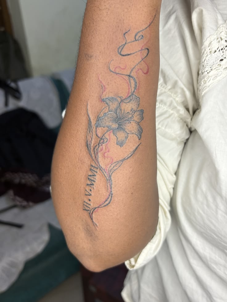 A perfect example of our fine-line floral work. This mini lily captures the elegance of nature with whispered lines and precise detail. Ideal for those looking for a sophisticated, feminine piece