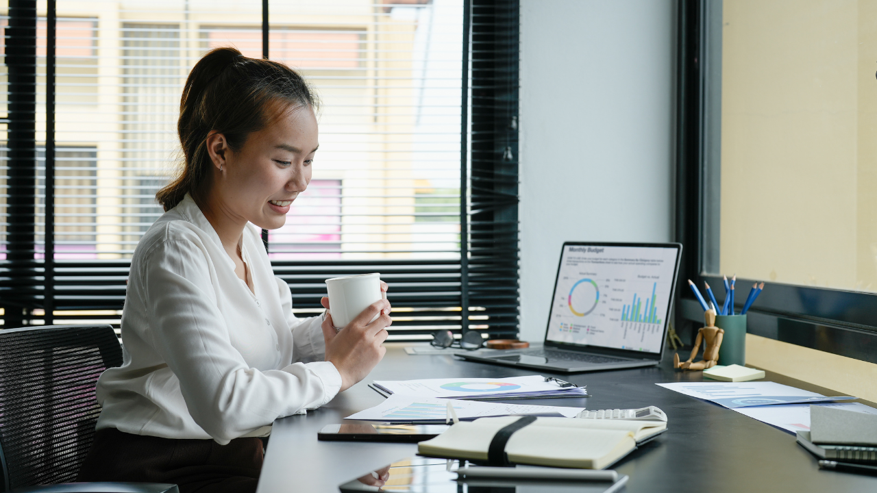 Woman checkin her business account data on laptop
