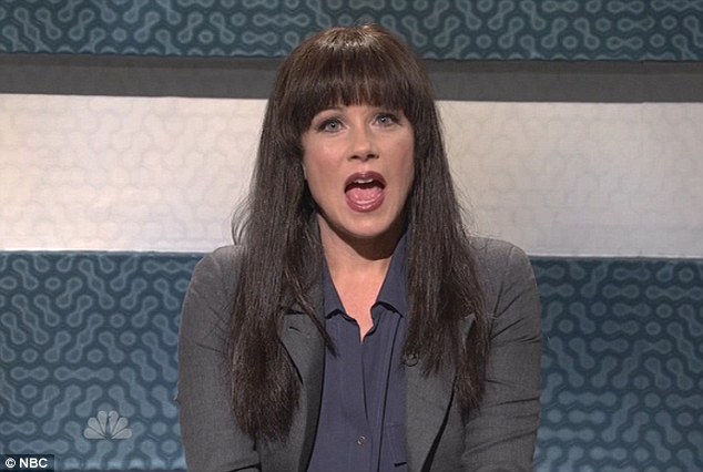 Dark lady: Christina dons a black wig and discusses glitches with the iPhone 5 in another funny act