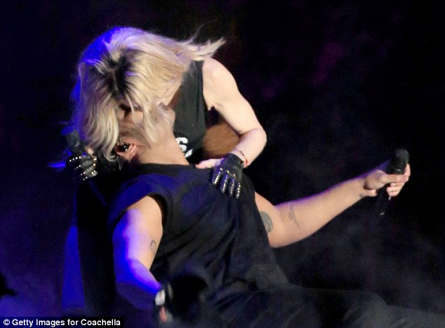Dominant: She appeared to bat his hand away to make sure hers was on top on the stage