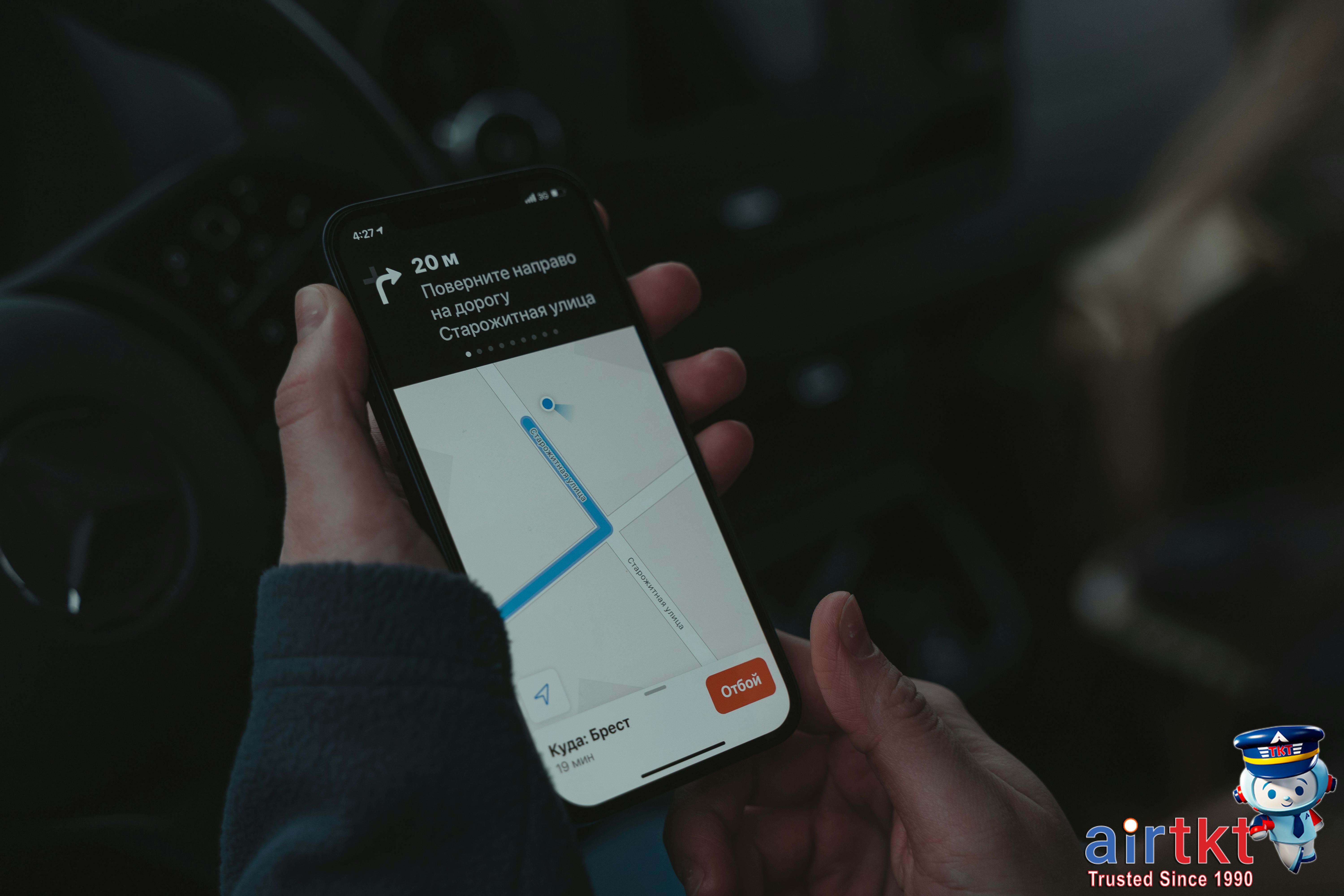 Person using Google Maps on smartphone outdoors