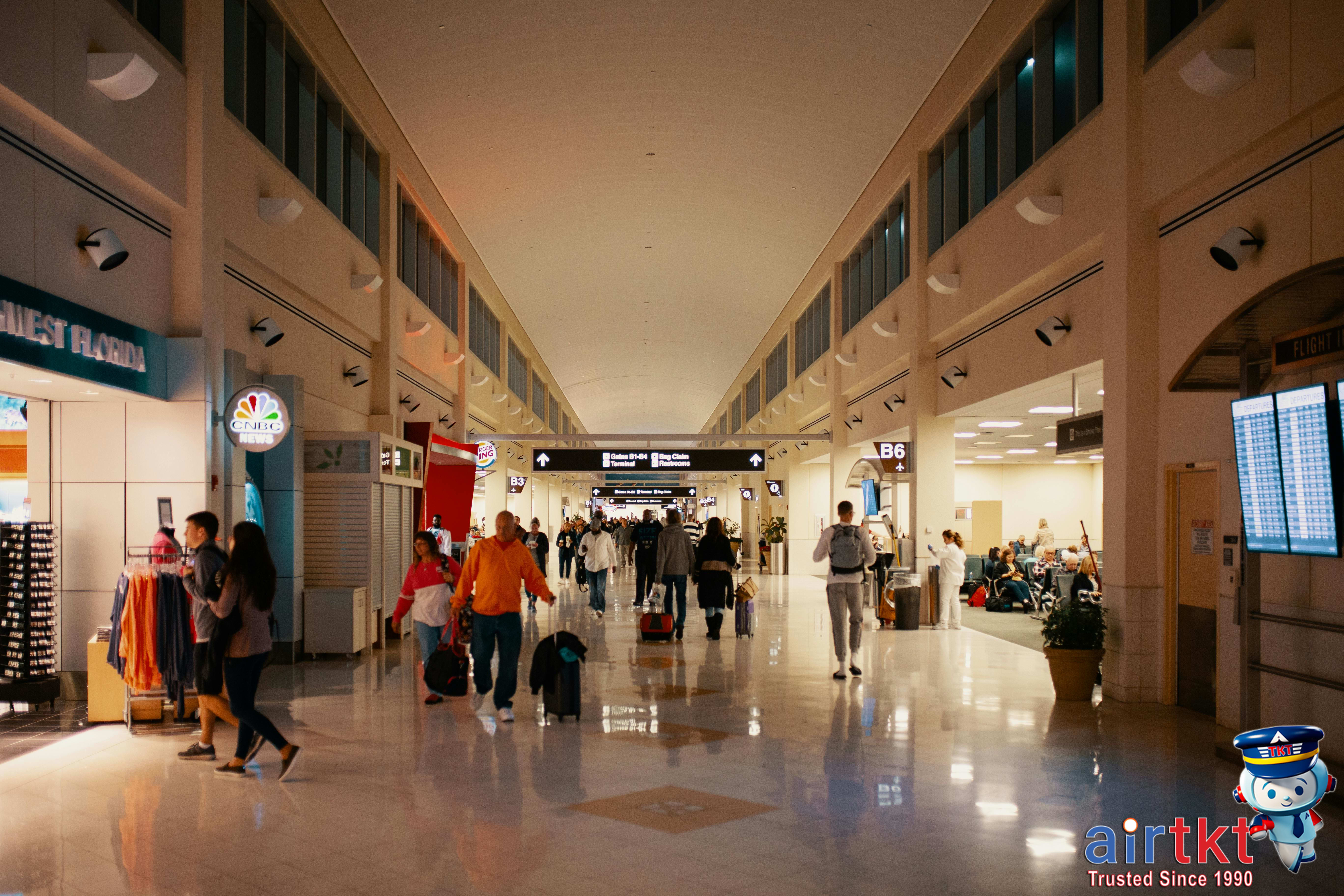 Family planning vacation budget with laptop and notes