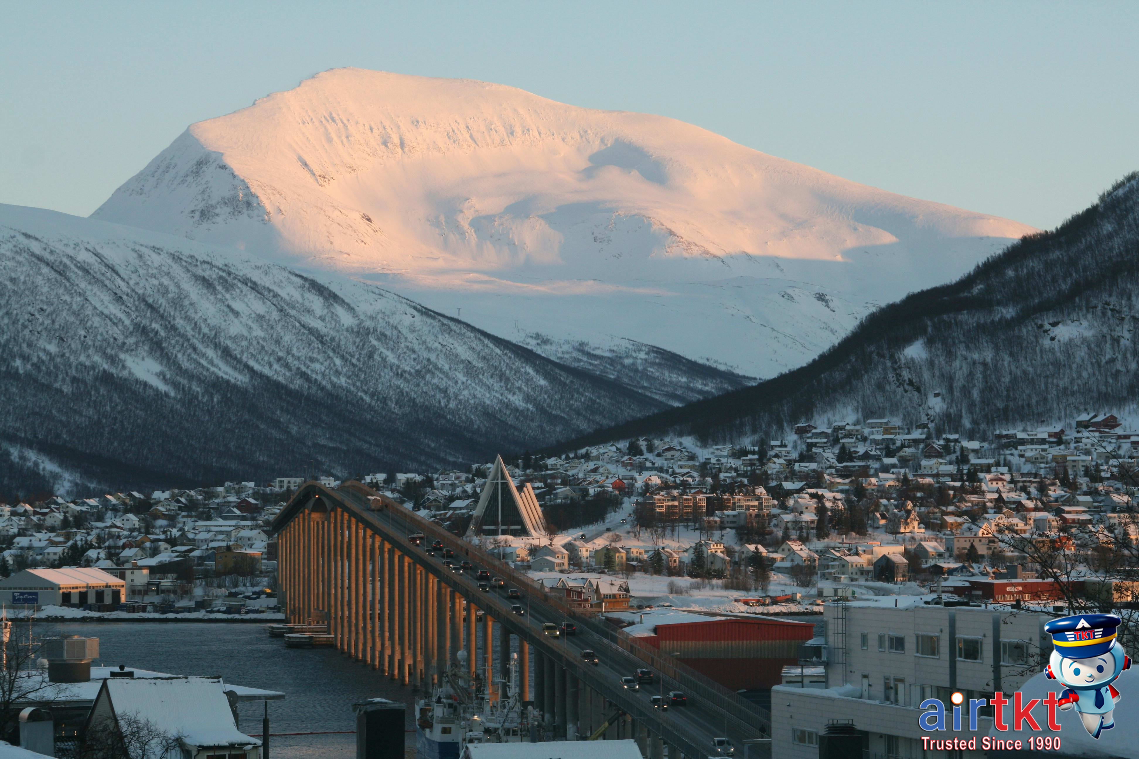 Aurora Borealis over snow-covered landscape