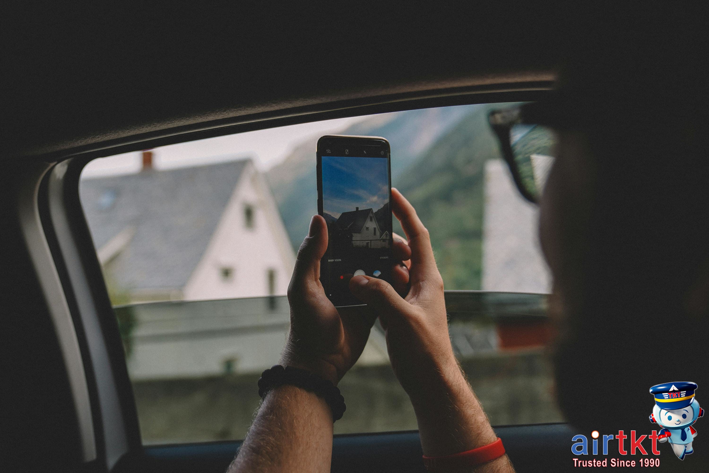 Car rental with documents and key on the dashboard