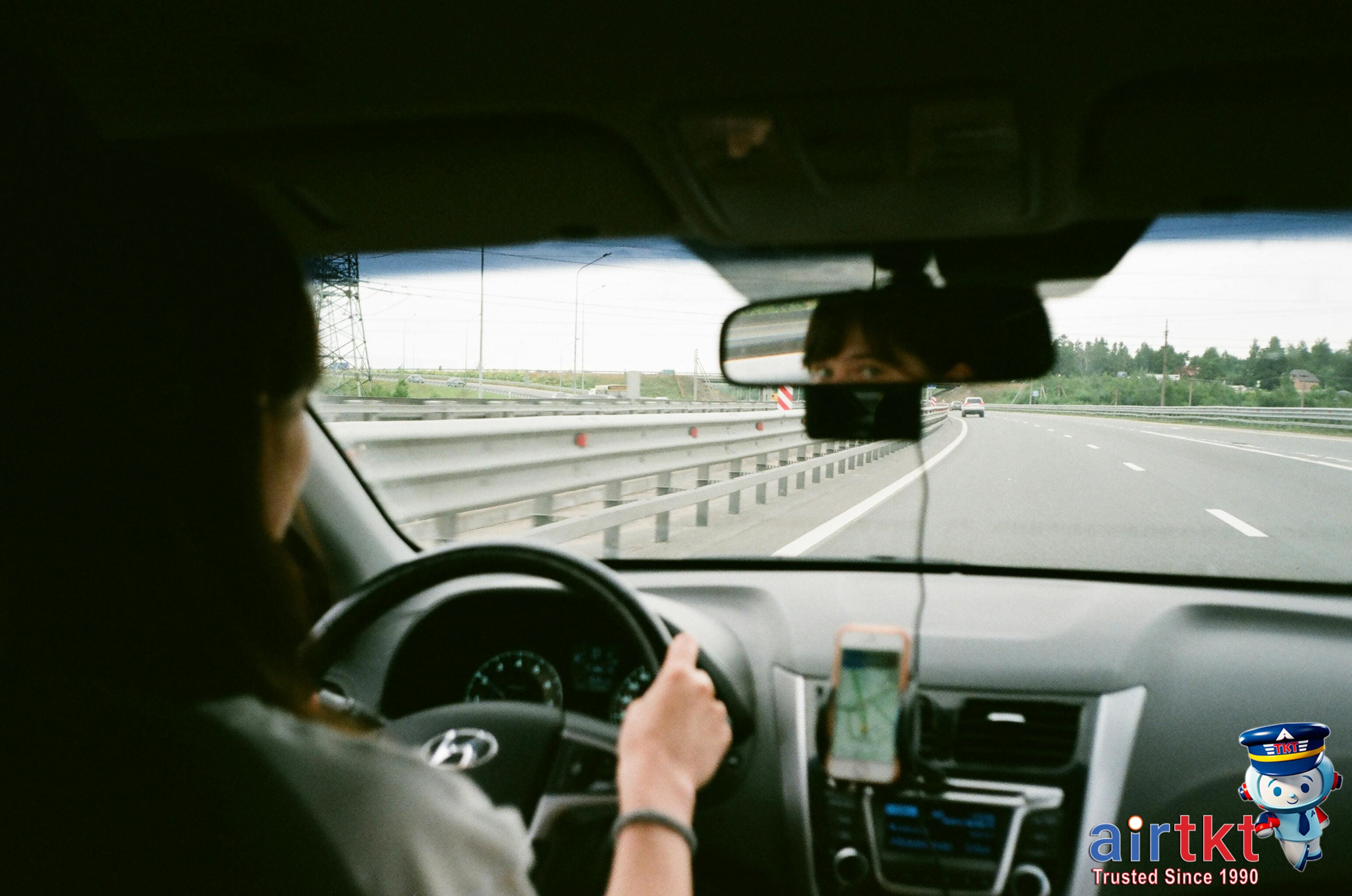 Car driving on international road with traffic signs