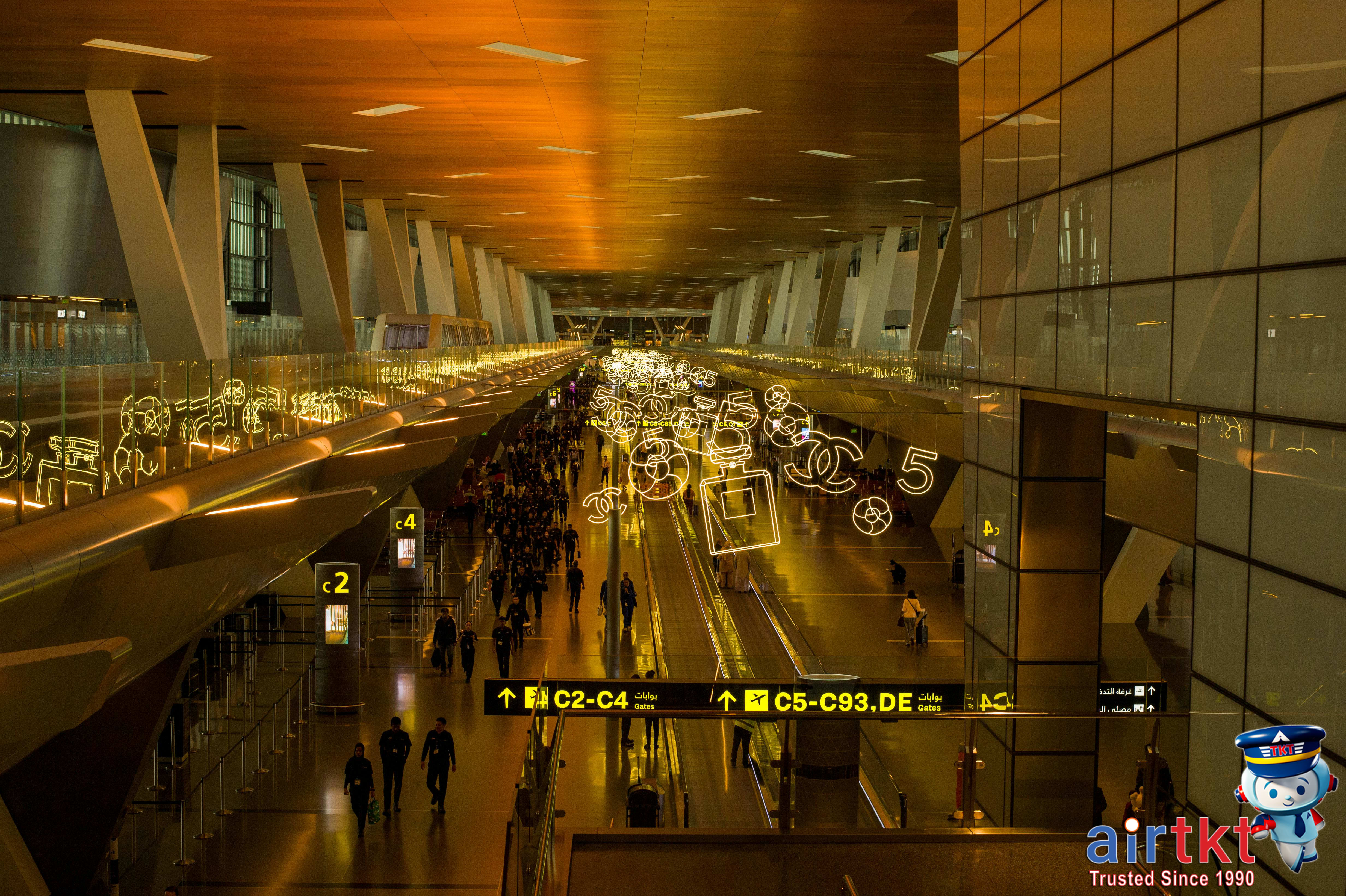 Busy airport terminal decorated for Christmas