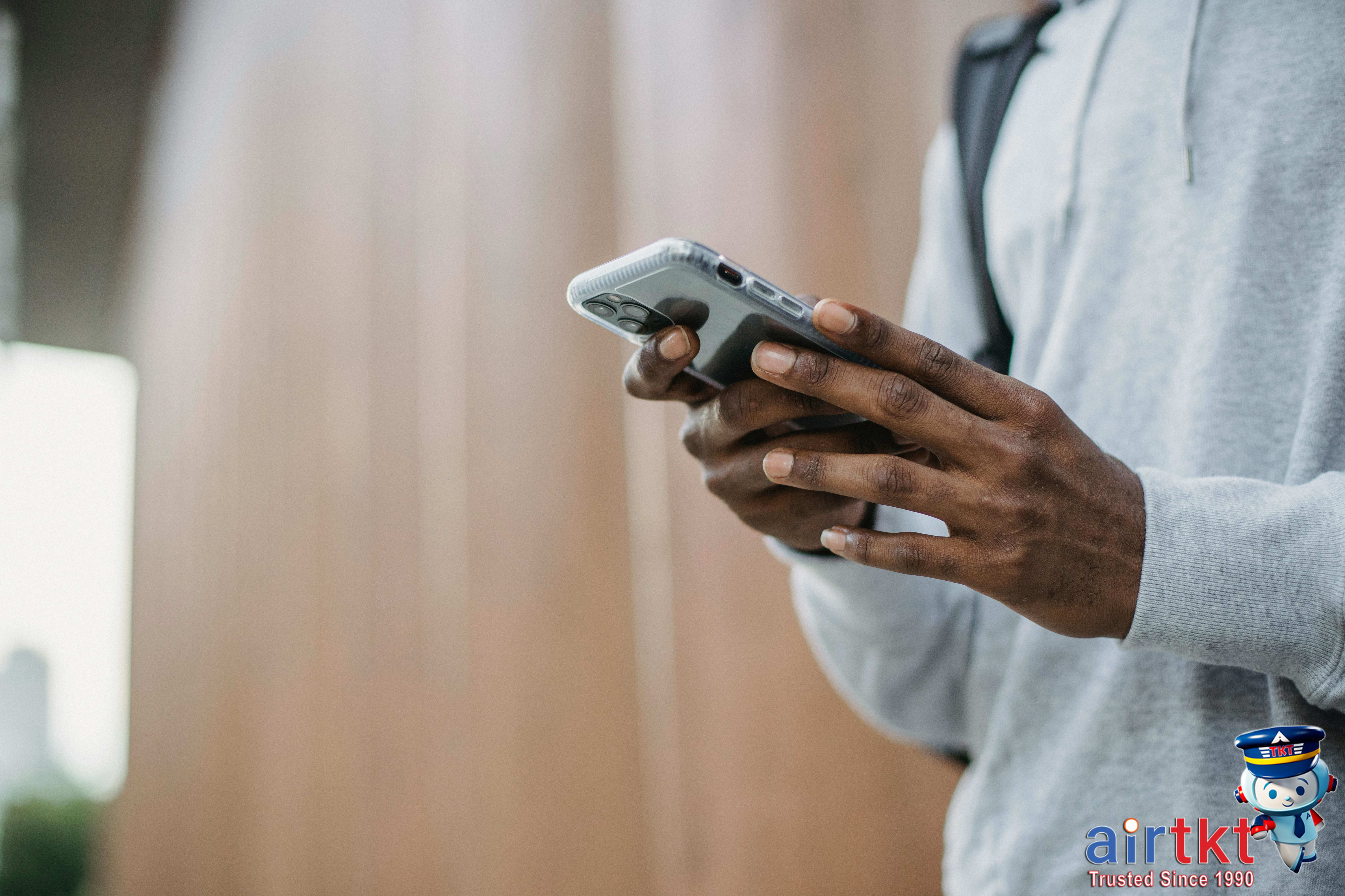 Traveler completing online check-in on mobile device