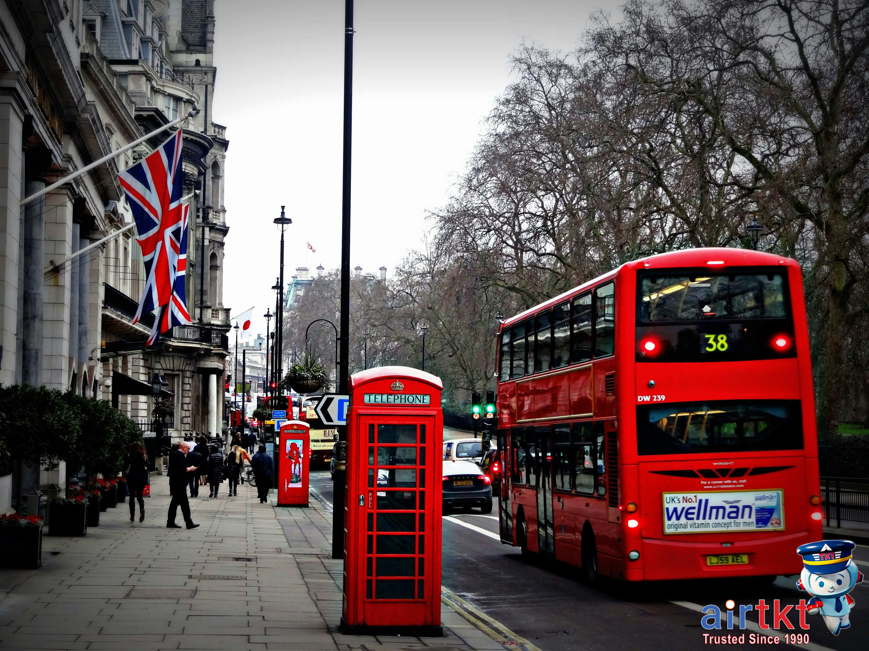 Cyclist riding a Santander Cycle in London neighborhood