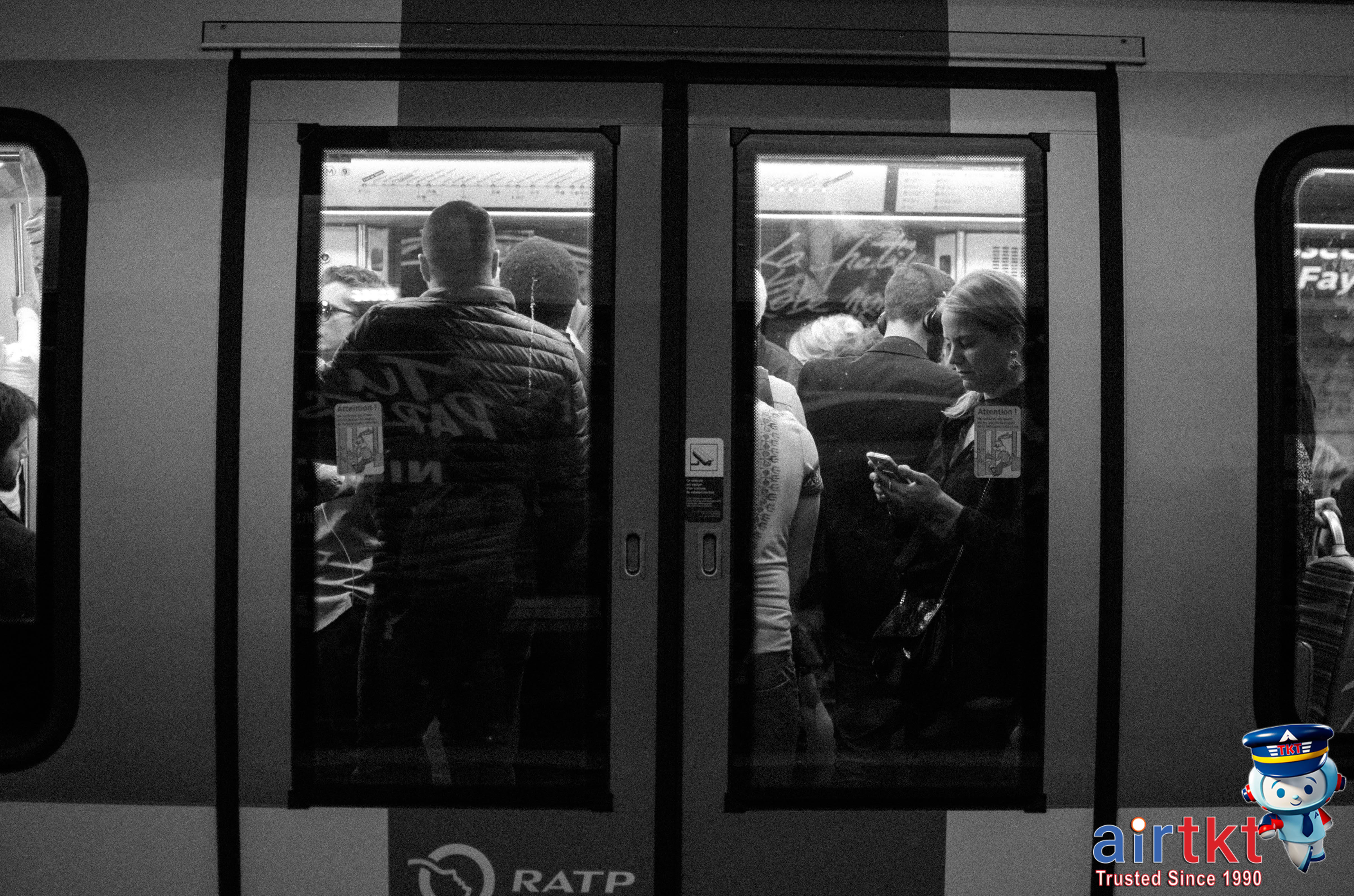 Paris Metro train approaching station with passengers