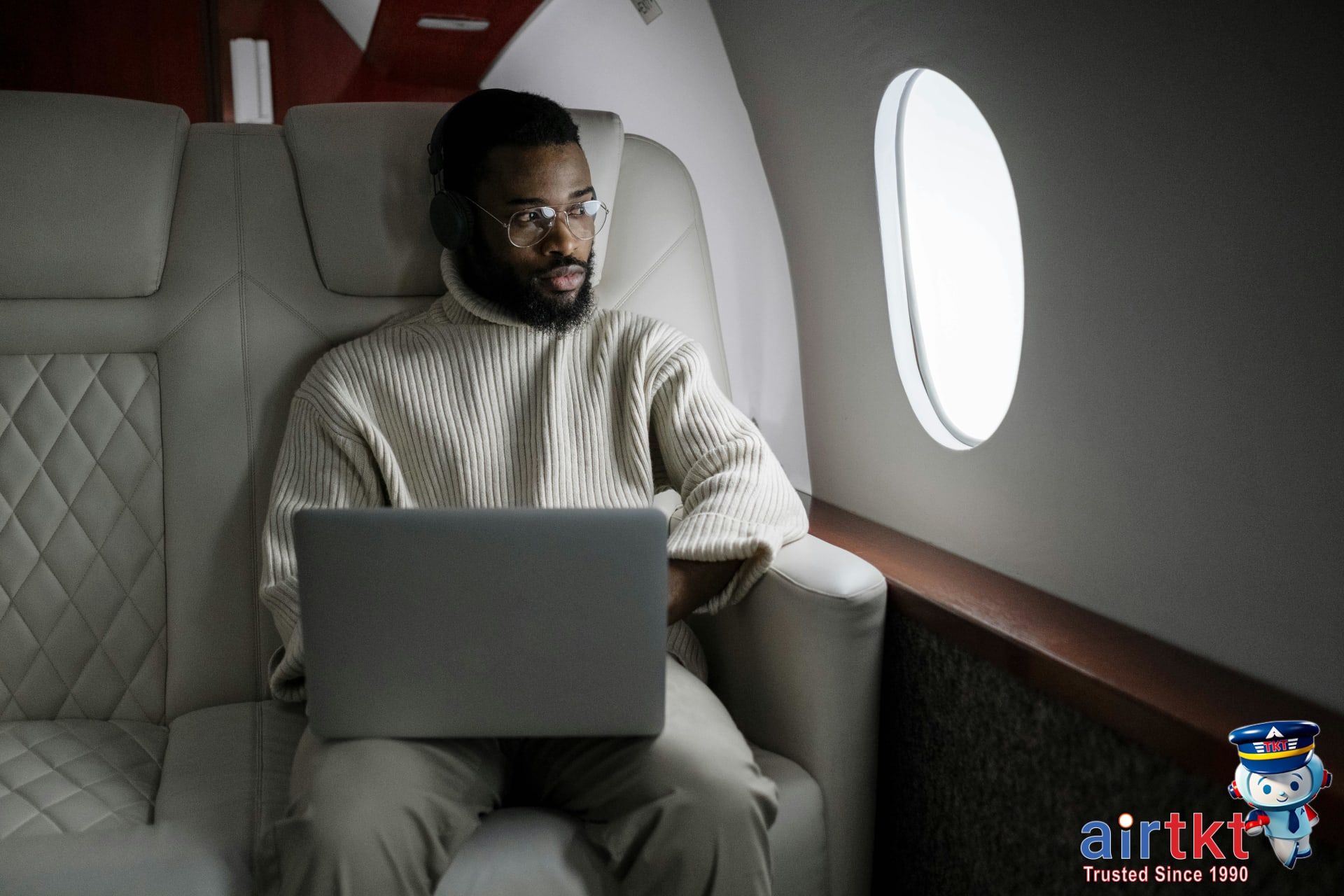 Man using laptop at home for flight price comparison
