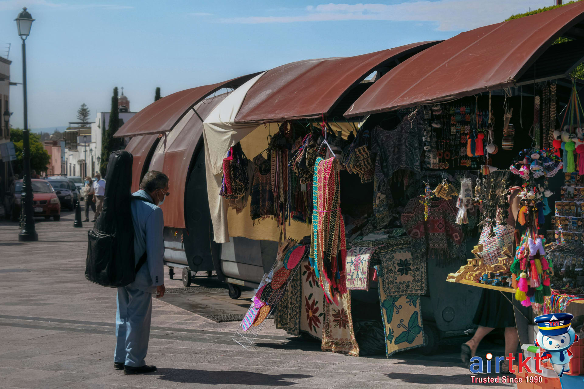 Suitcase packed with wrapped souvenirs ready for travel