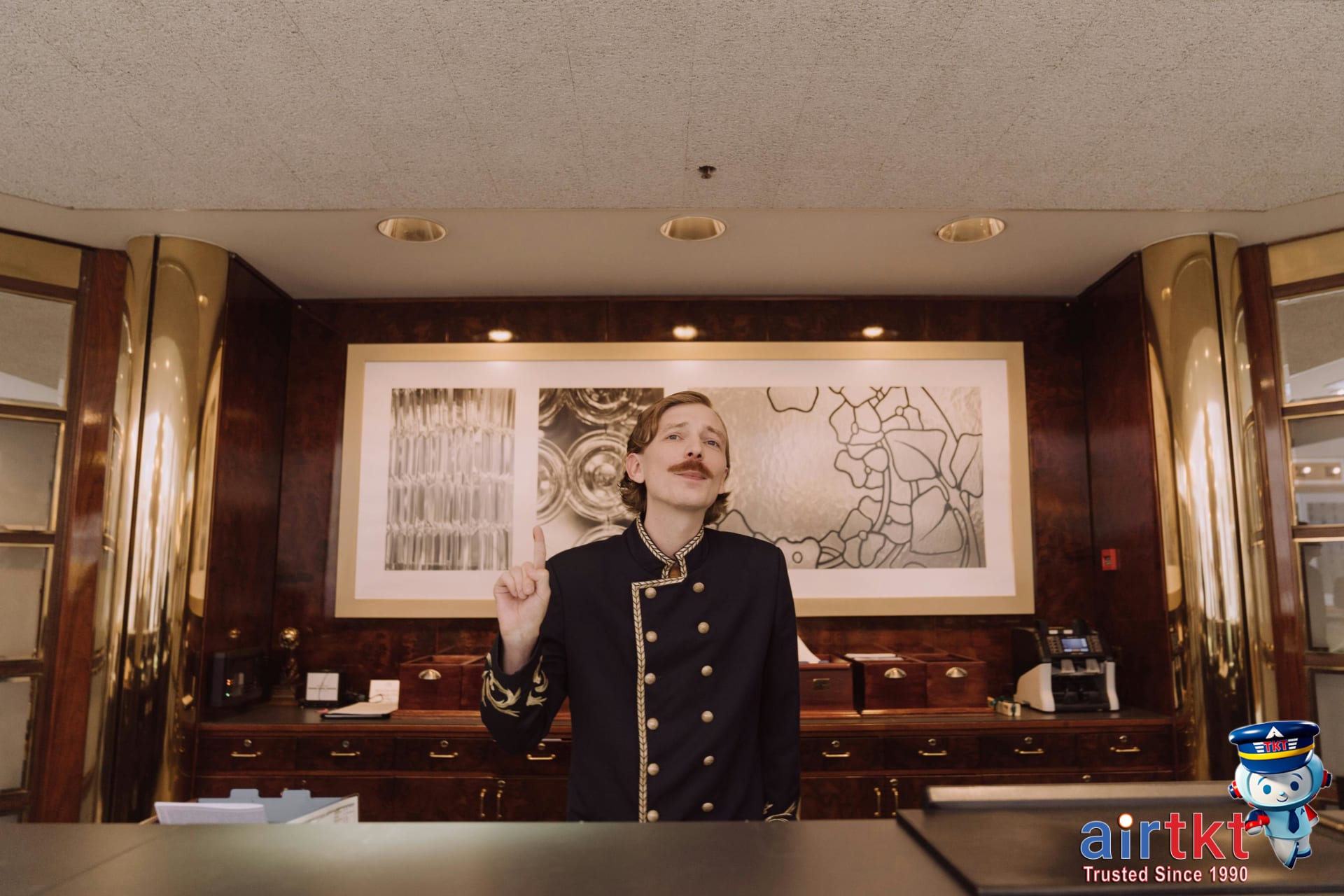 Busy hotel front desk with guests walking in for last-minute stays