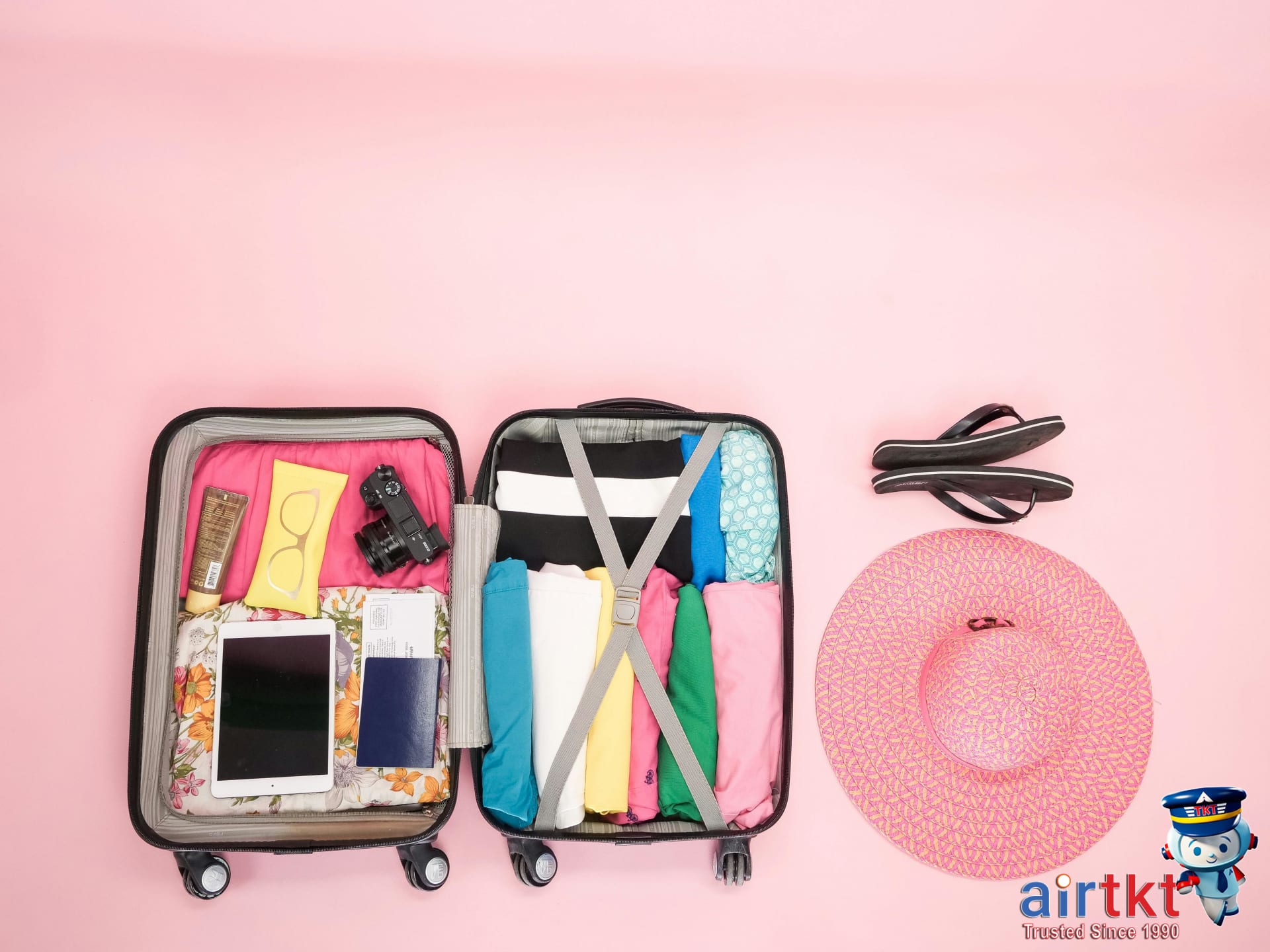 Traveler packing suitcase for tropical beach vacation