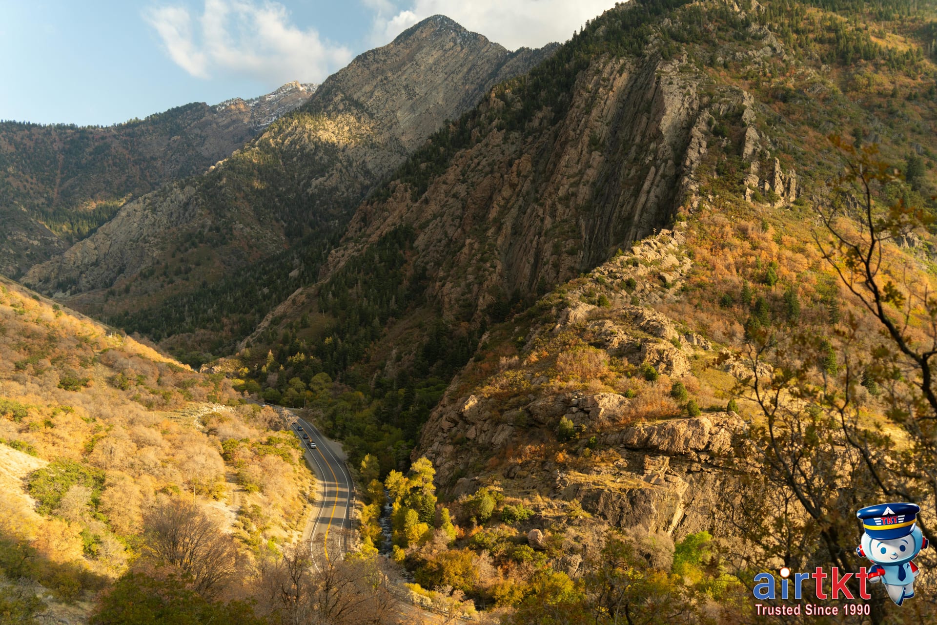 Busy street in Salt Lake City with mountains in the background