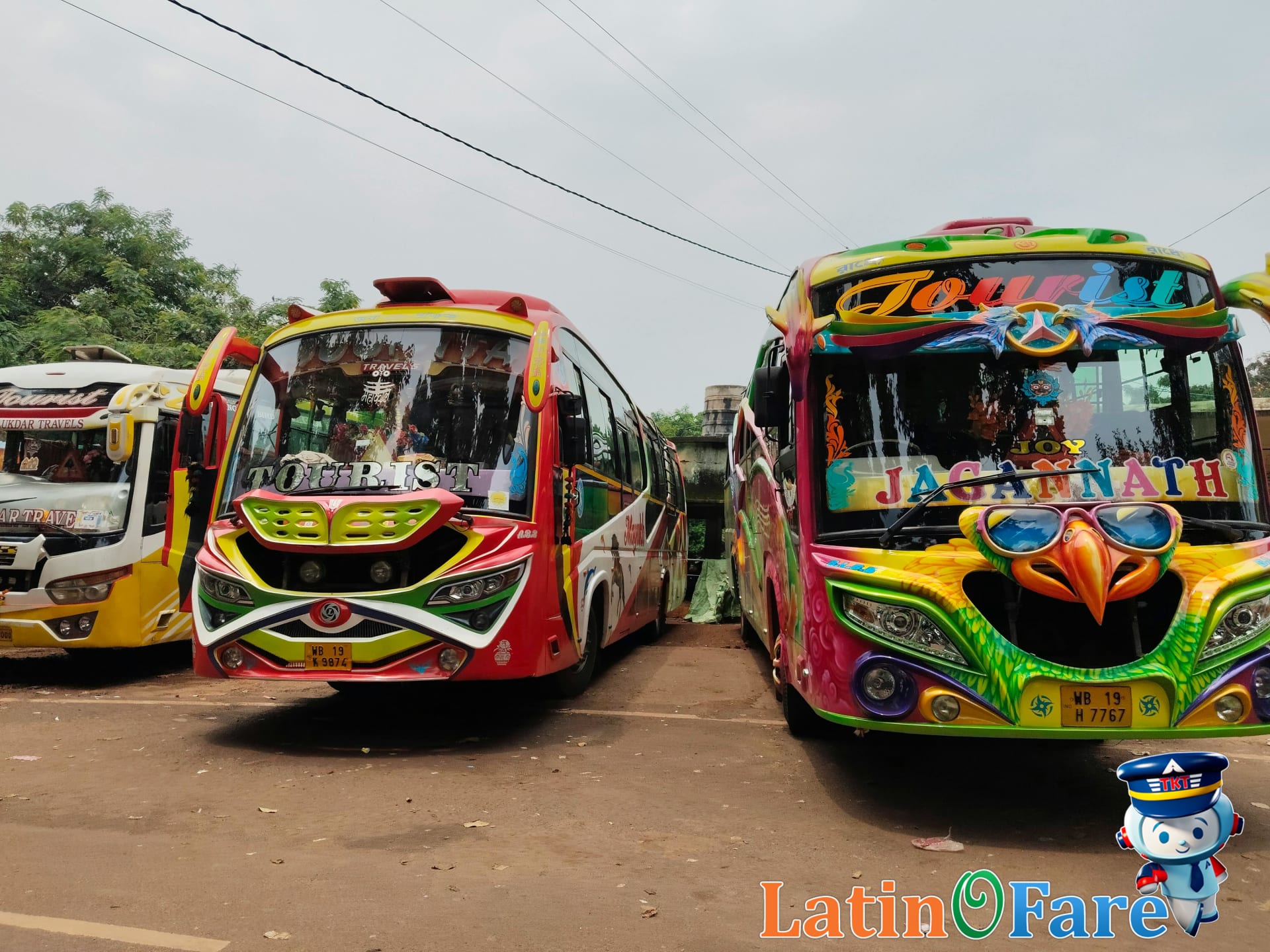 Colorful tourist buses parked in a row during daylight in Anchorage