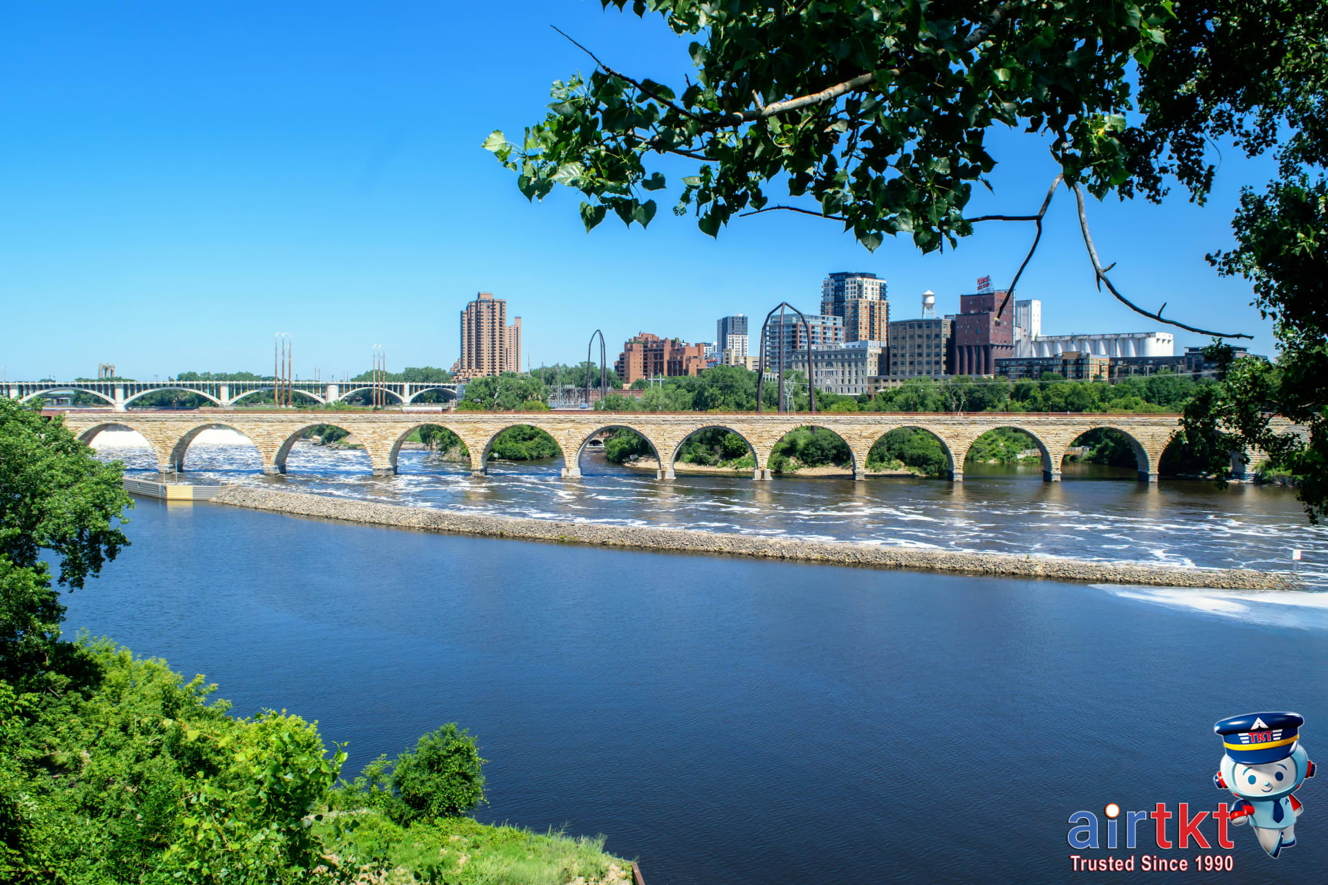 View of Minneapolis city skyline with lakes and natural surroundings