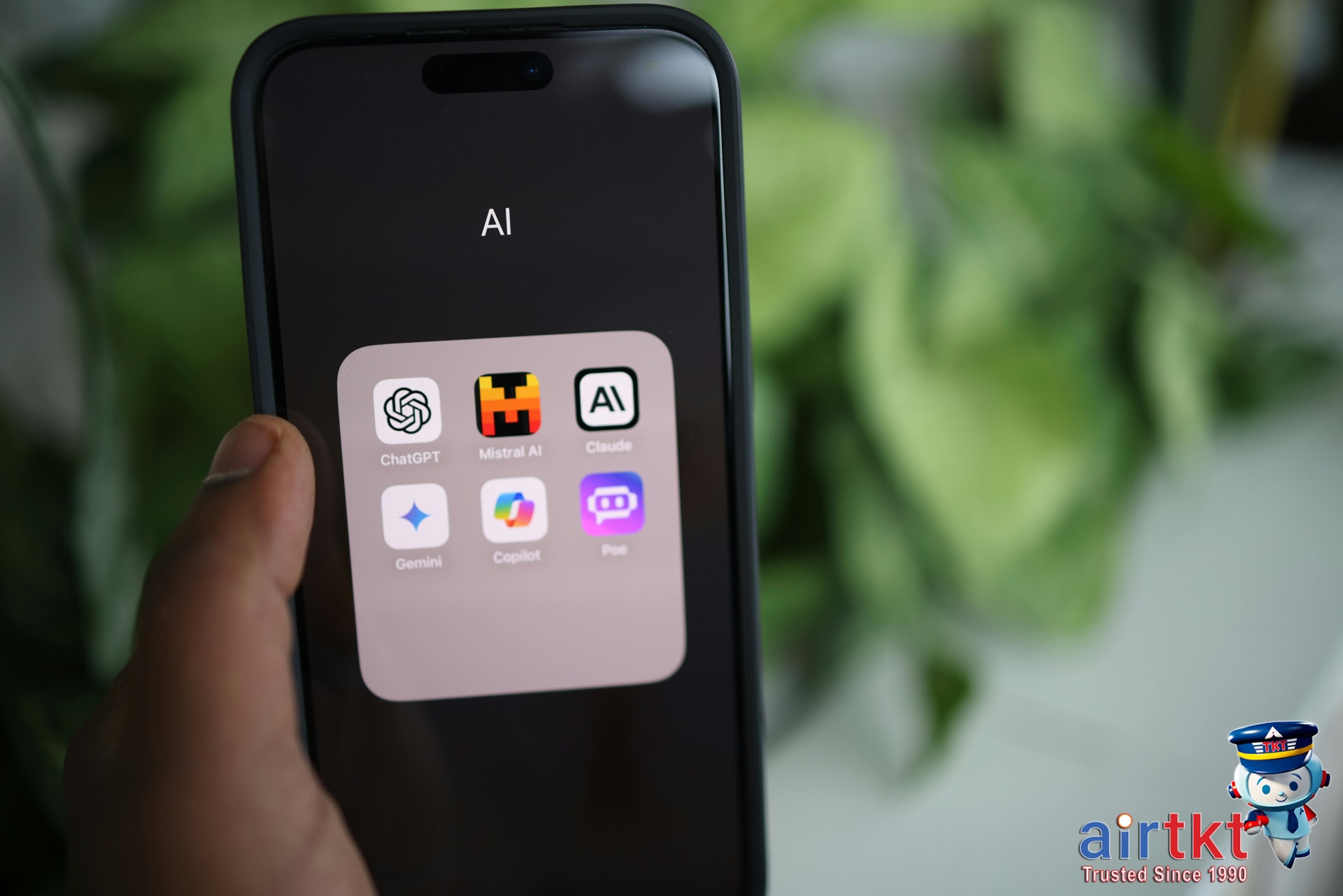 Traveler using phone app to book flight and hotel bundle