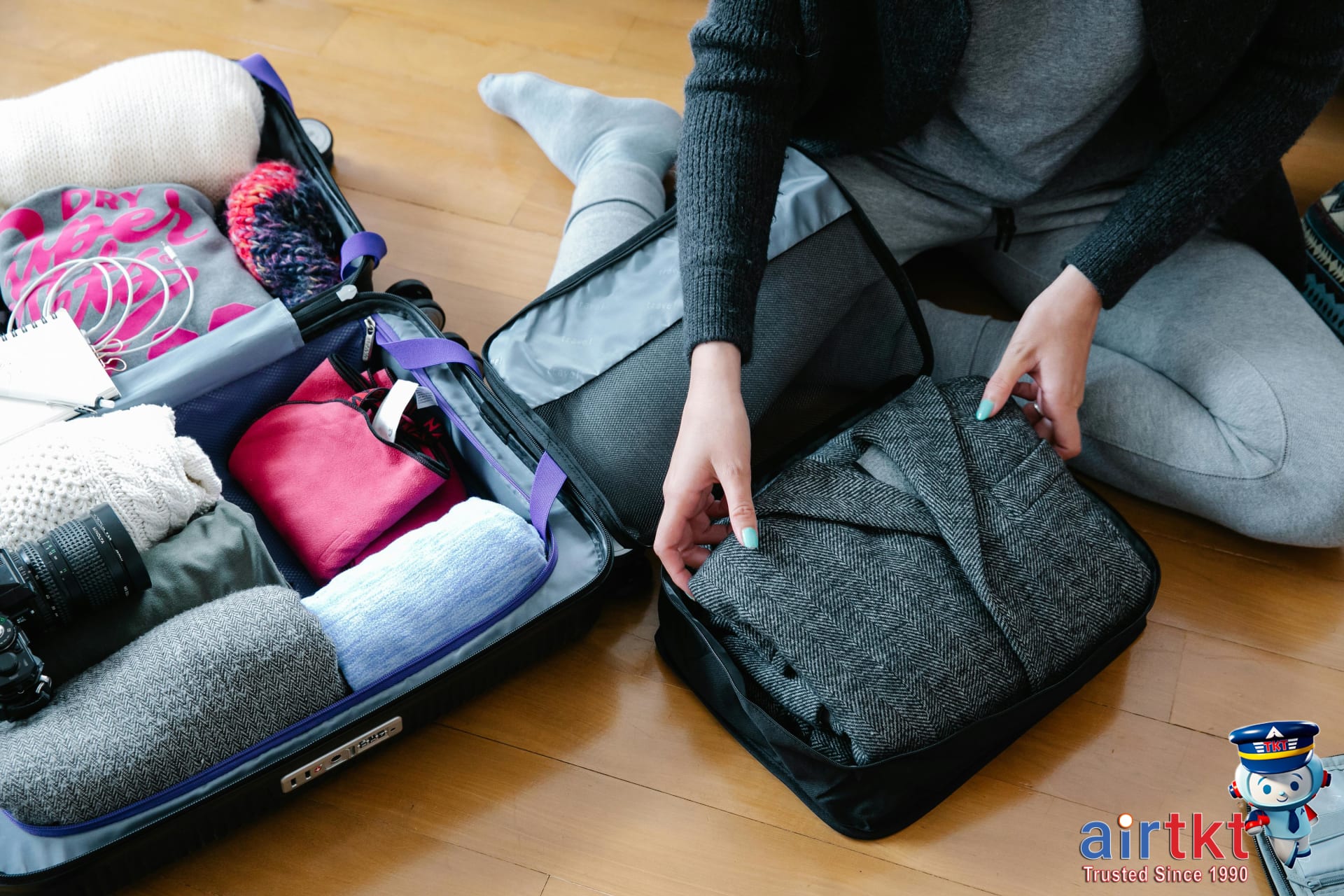 Traveler packing clothes for efficient laundry travel