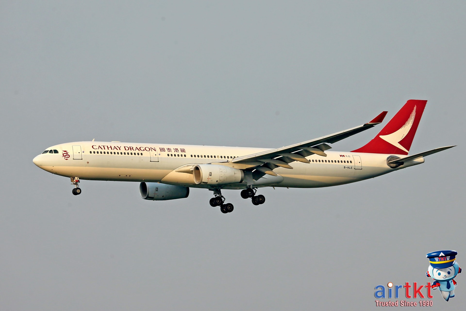 Cathay Pacific airplane flying in blue sky