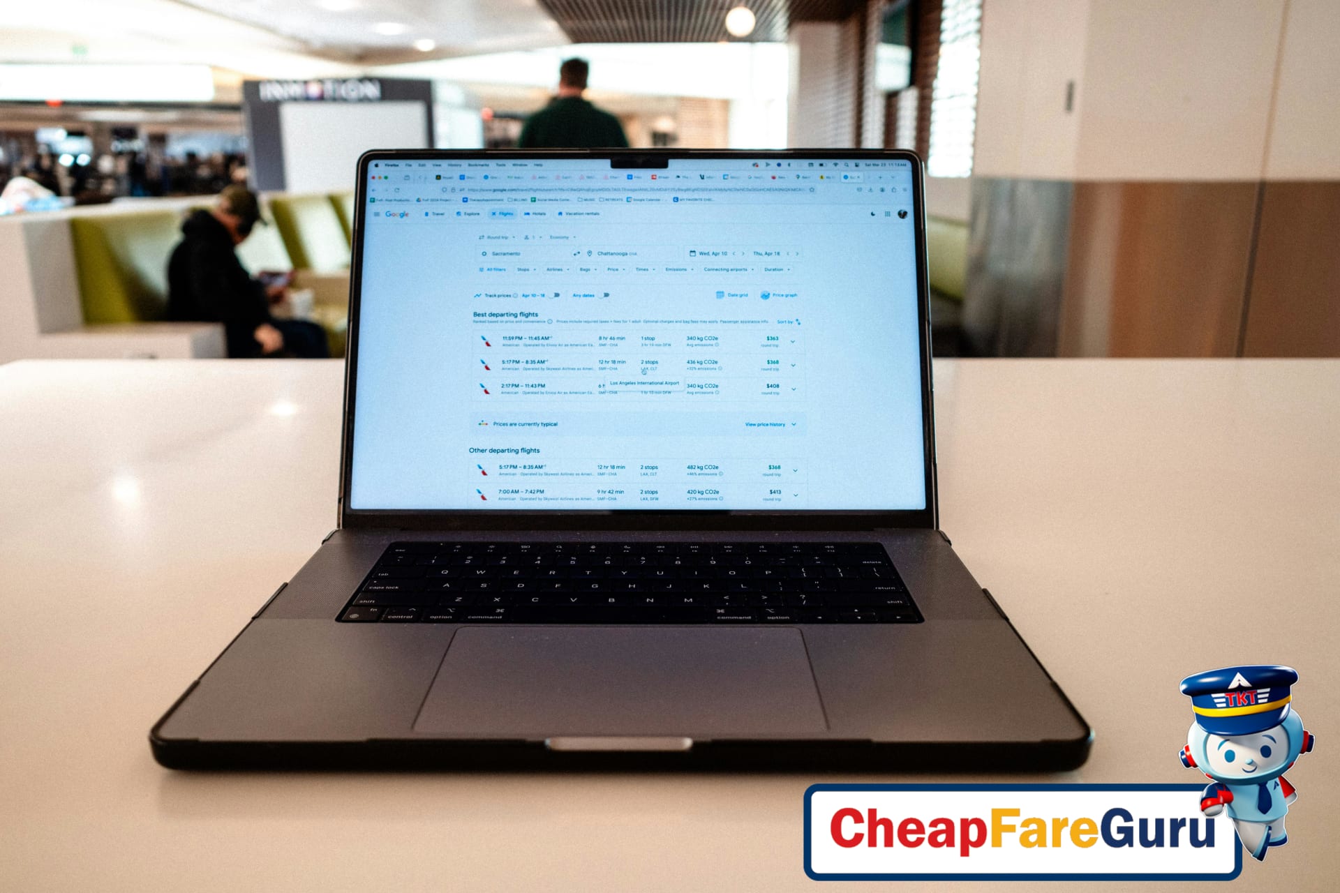 Traveler booking ANA flight with laptop