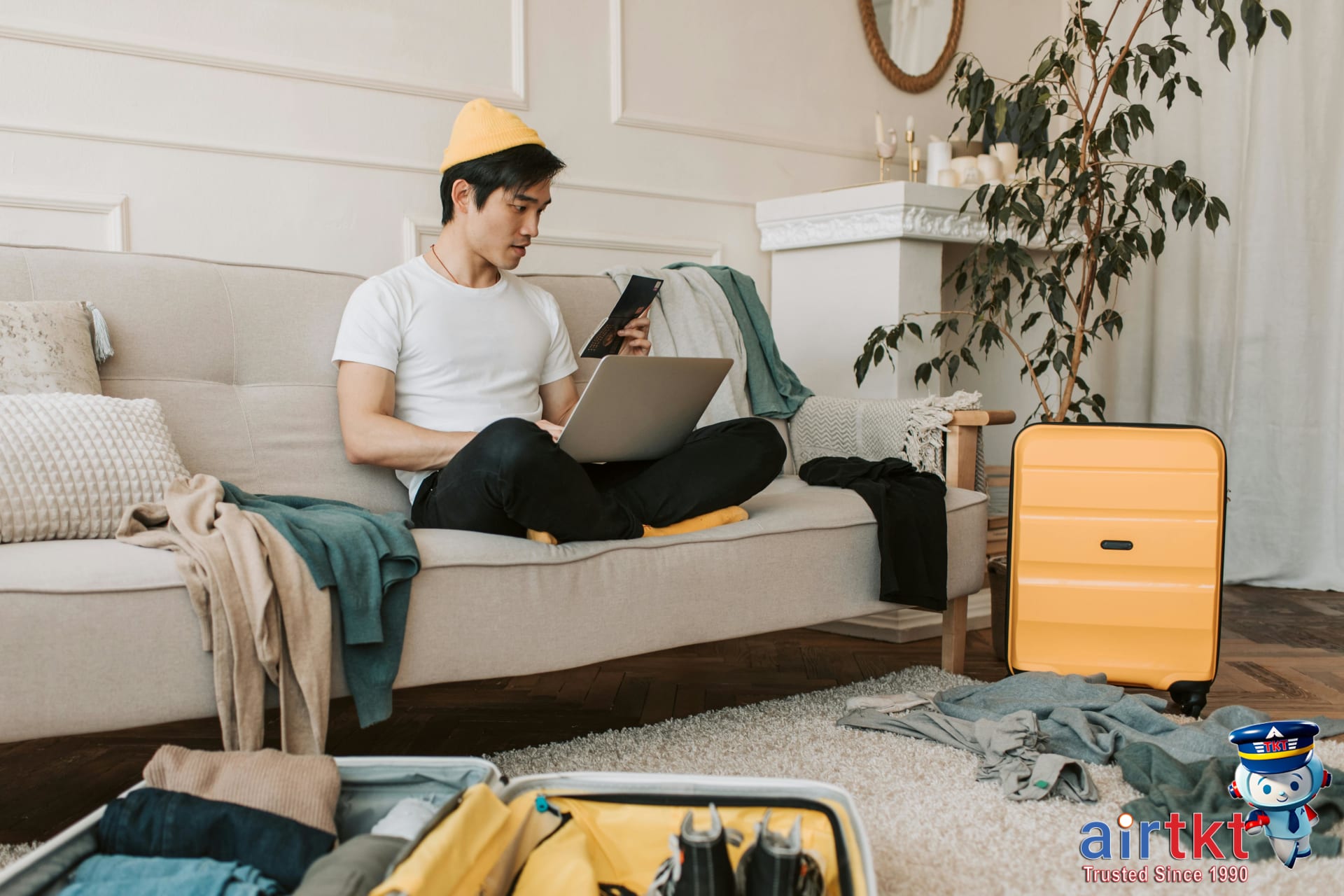 Traveler using smartphone to manage elite status programs