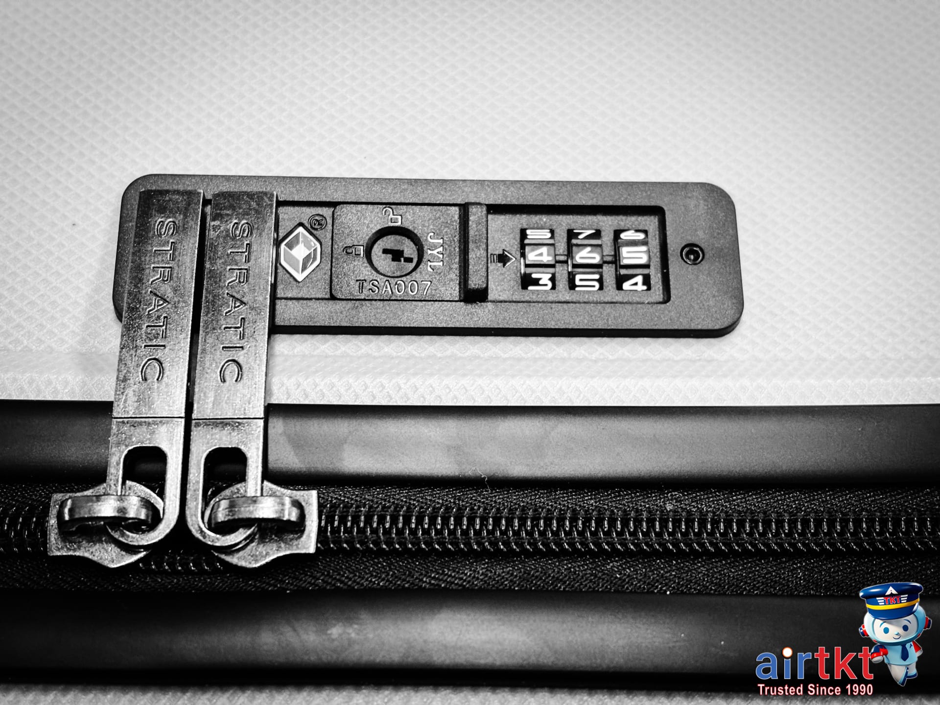 Traveler preparing luggage with TSA-approved locks