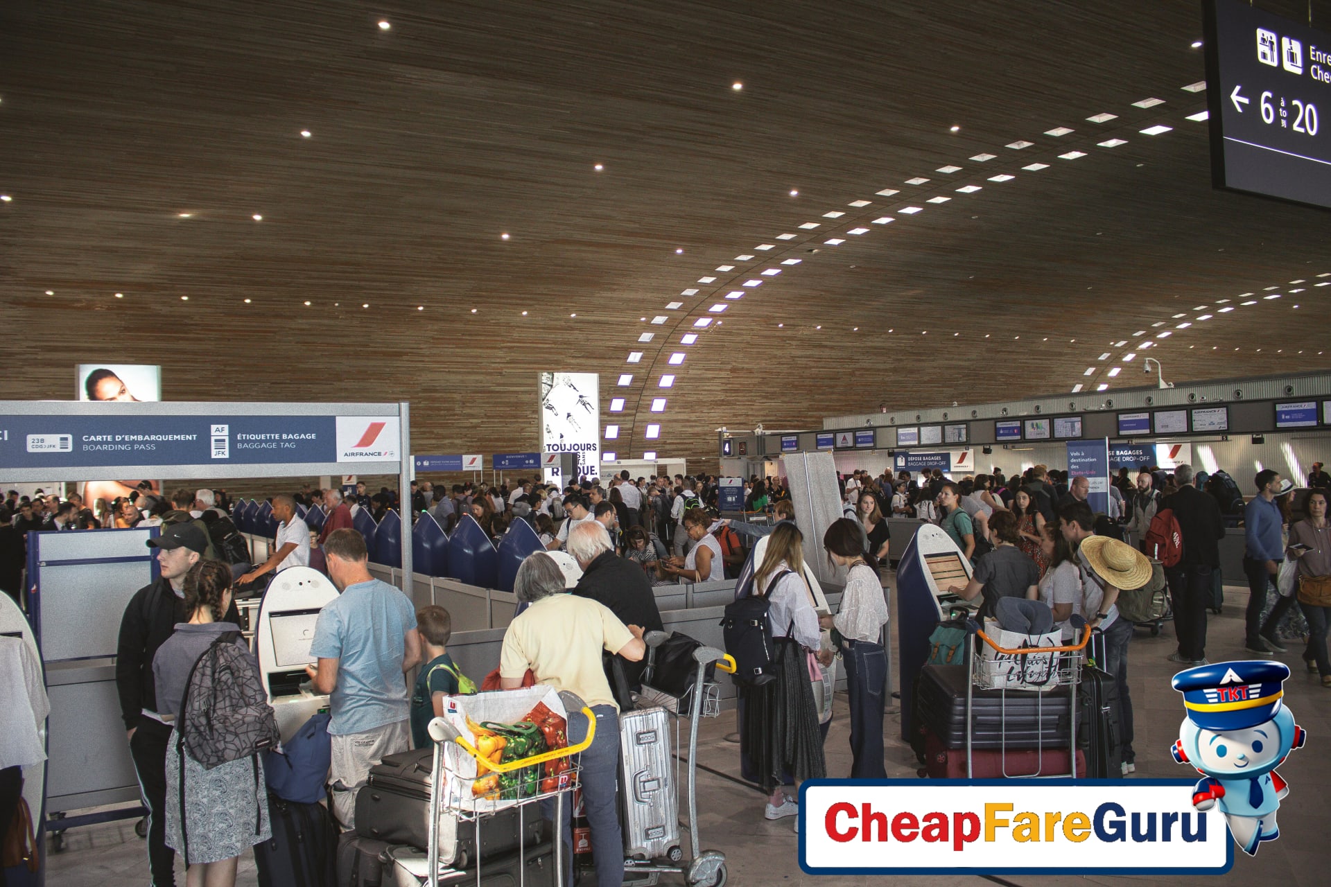 Crowded airport terminal with travellers waiting in line