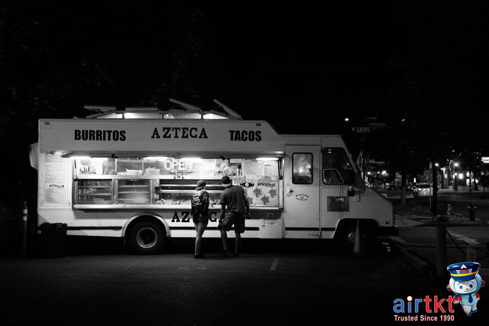 Bustling food truck scene with diverse crowd street food