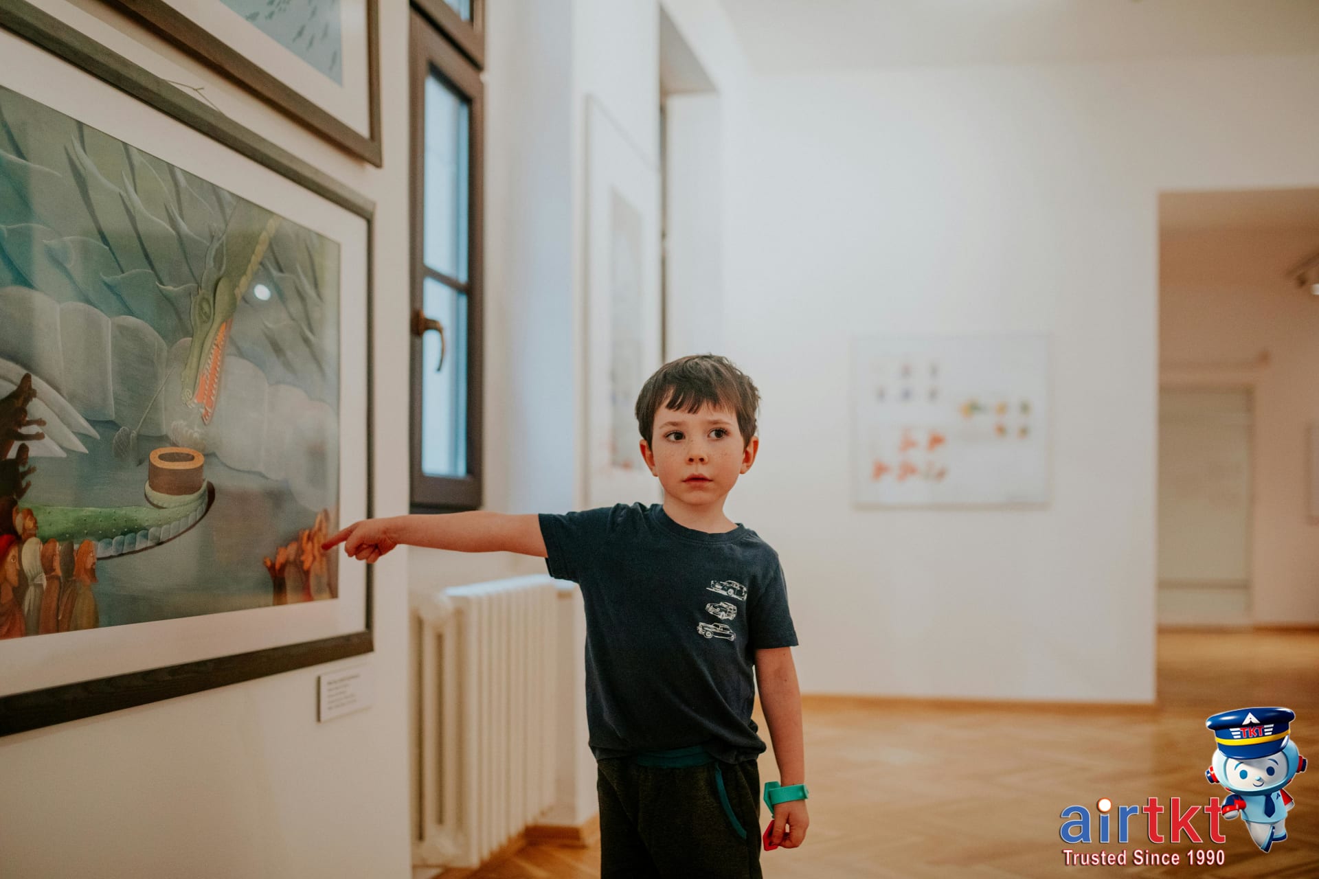Young boy exploring artwork at a museum
