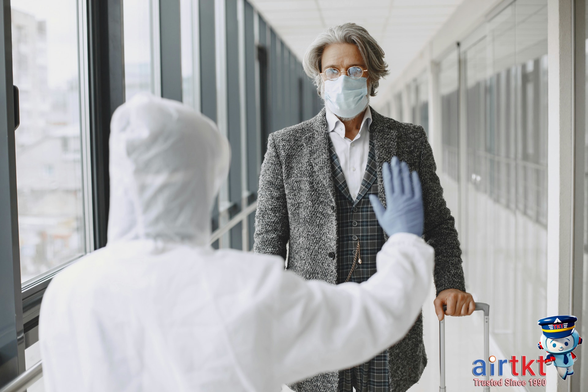 Traveler organizing cables and electronic accessories for security screening