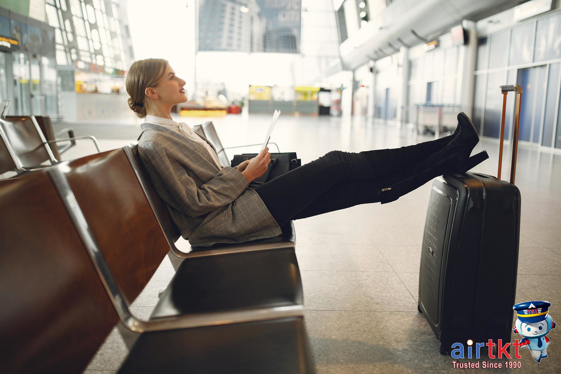 Avianca airplane flying over a cityscape