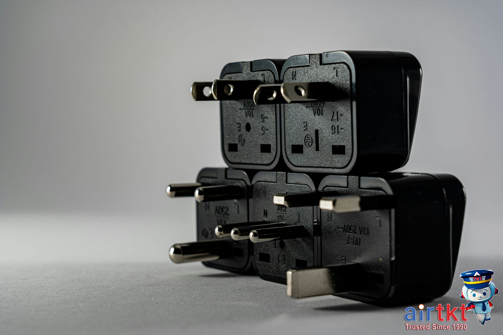 Universal travel adapter with multiple plugs