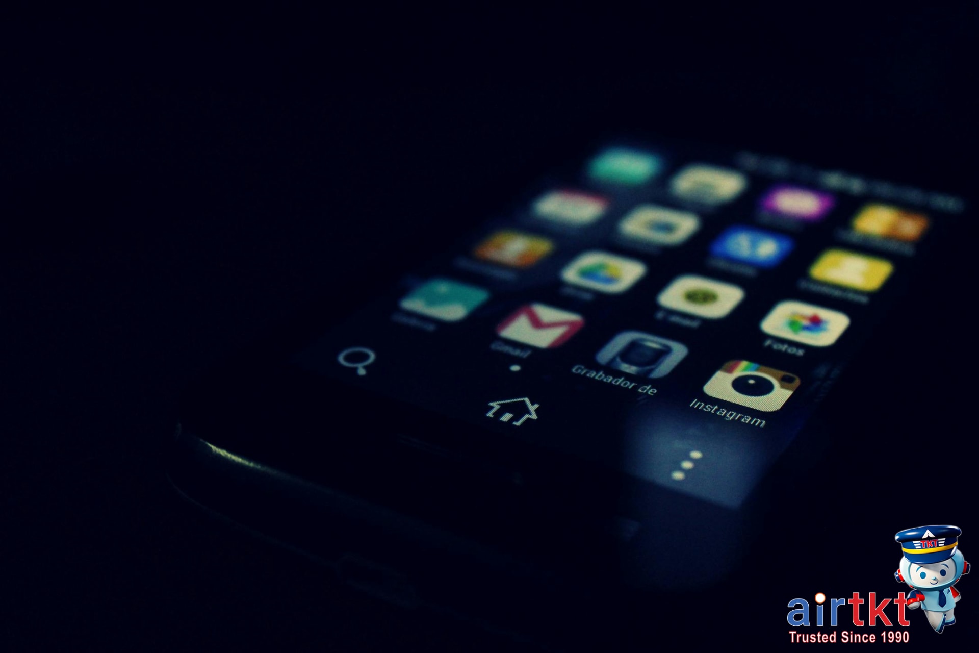 Airplane flying over clouds at sunset