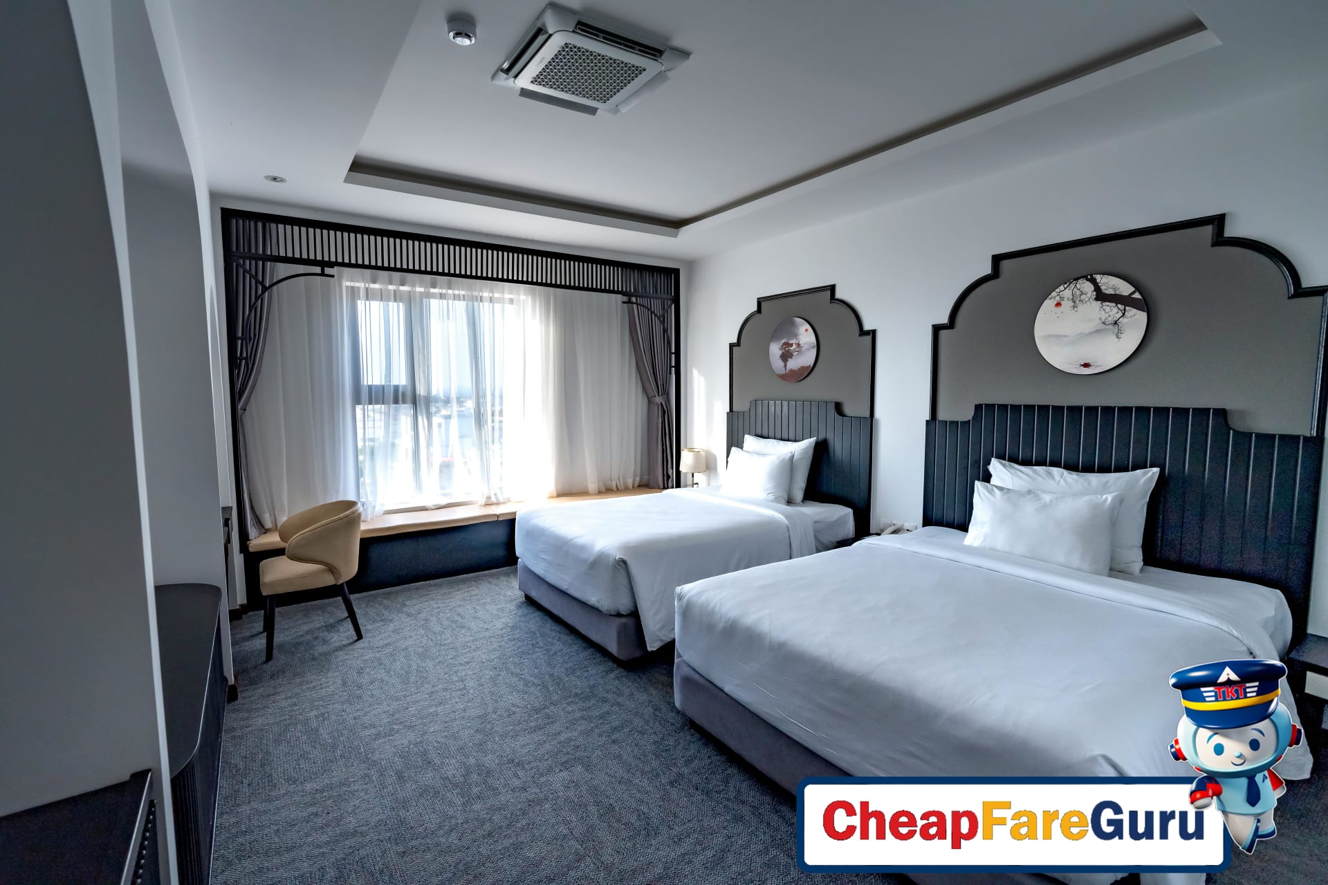 Modern hotel room with twin beds and elegant decor