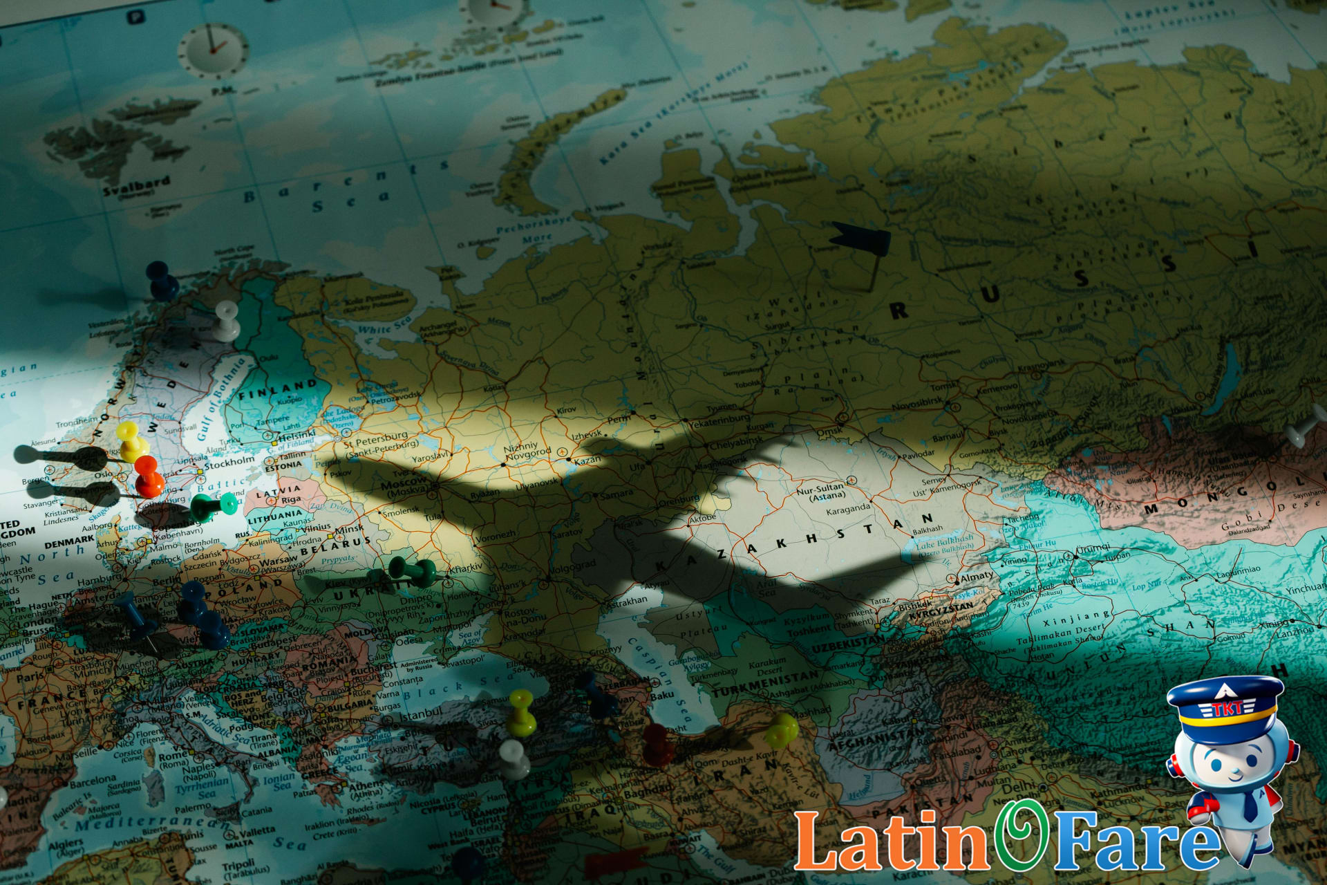 Shadow of an airplane on a map of Europe highlighting travel routes