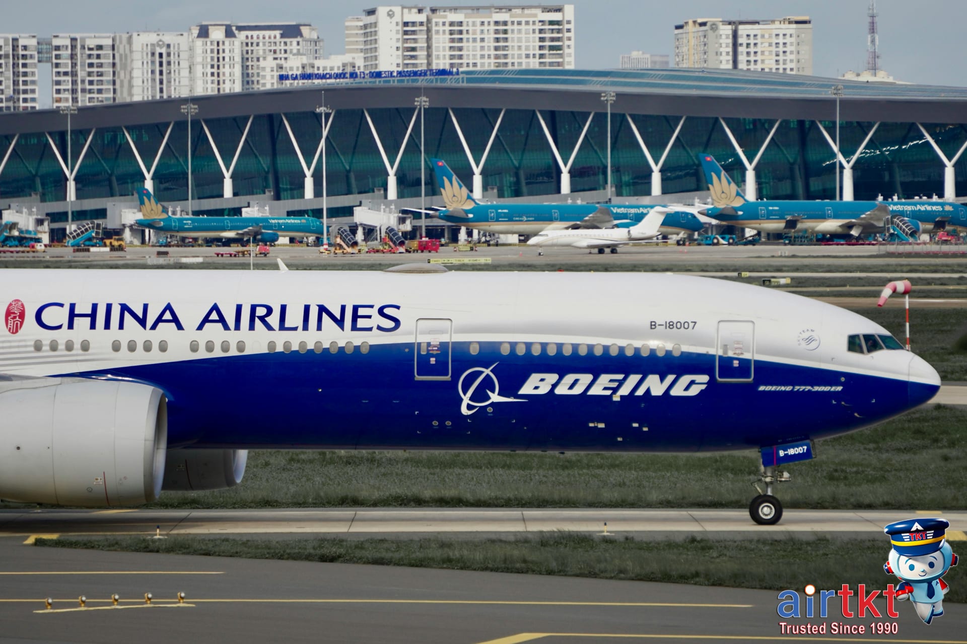 Airplane flying over ocean sunset