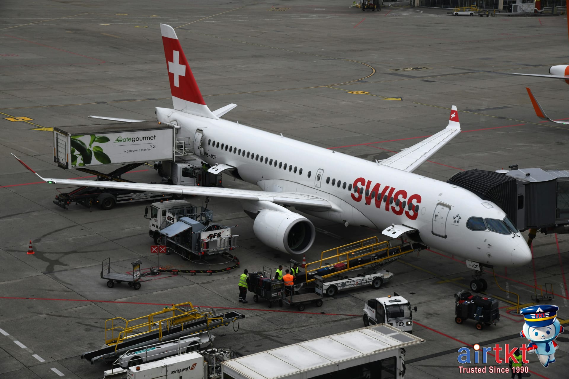 Swiss Airbus airplane at Geneva Airport terminal