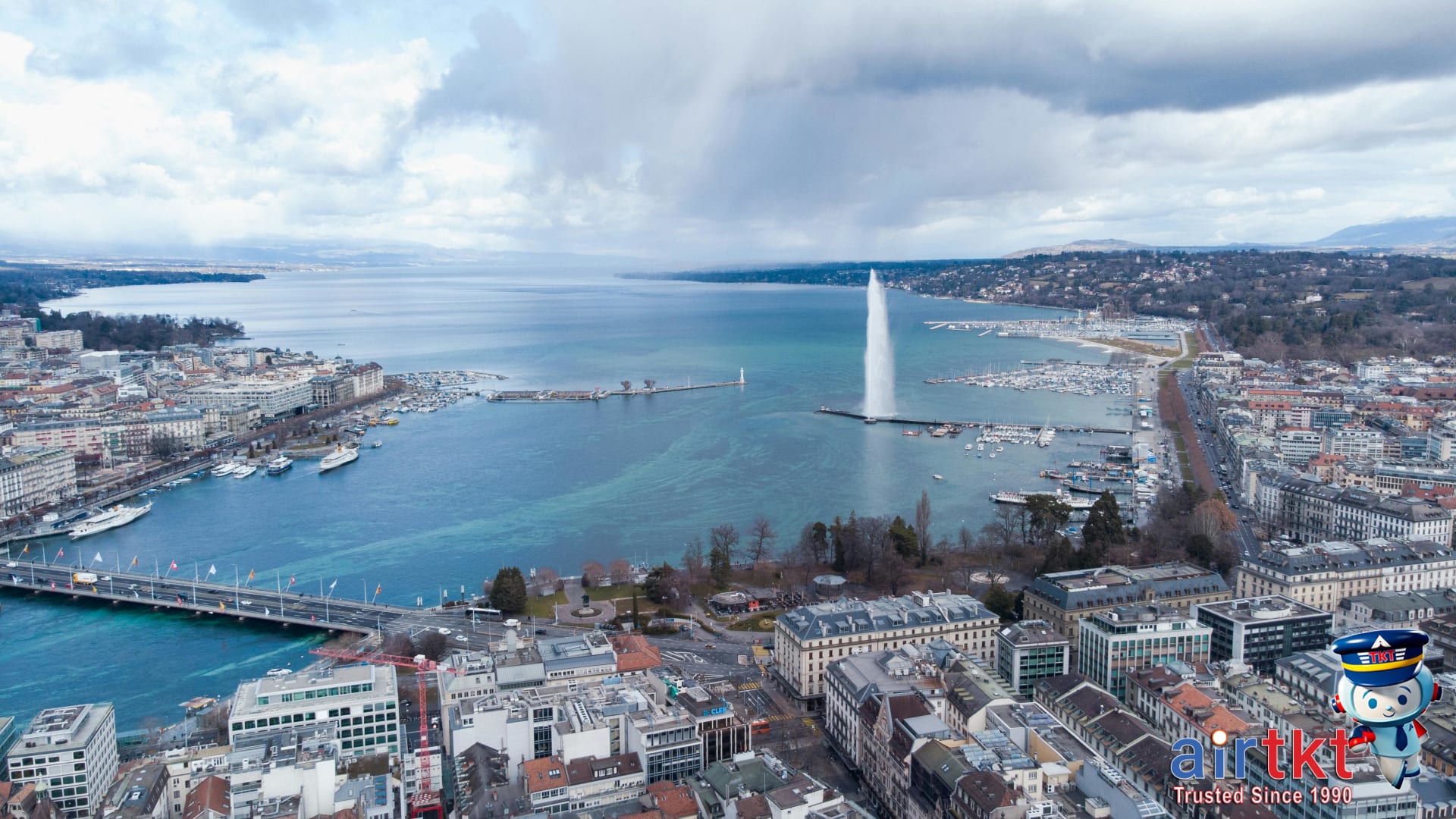 Lake Geneva panoramic view with Jet d’Eau fountain and cityscape