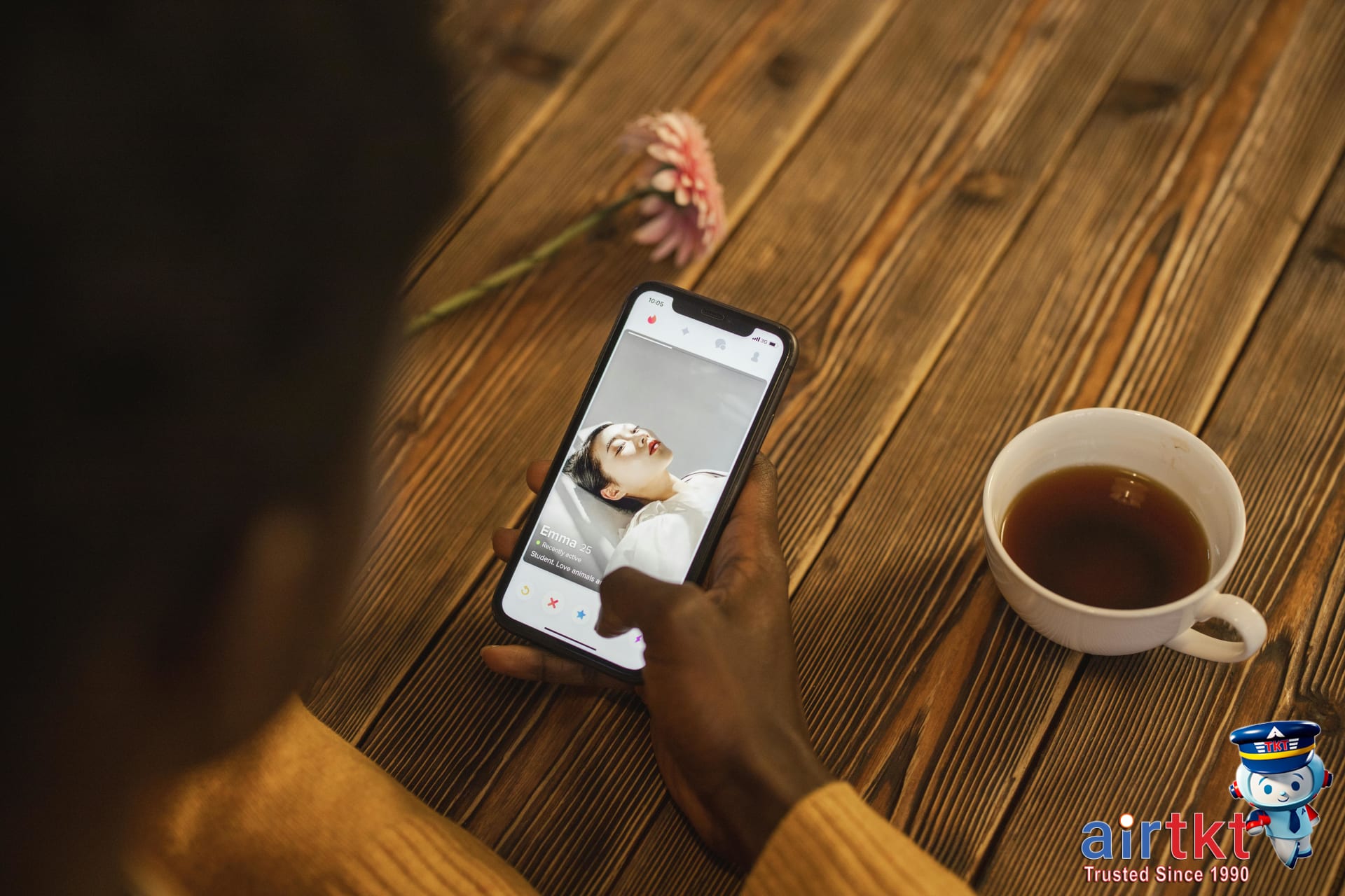 Person using smartphone for flight booking