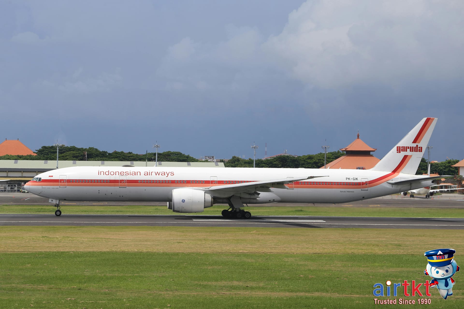 Secondary Southeast Asia airport with airplanes and terminal signage