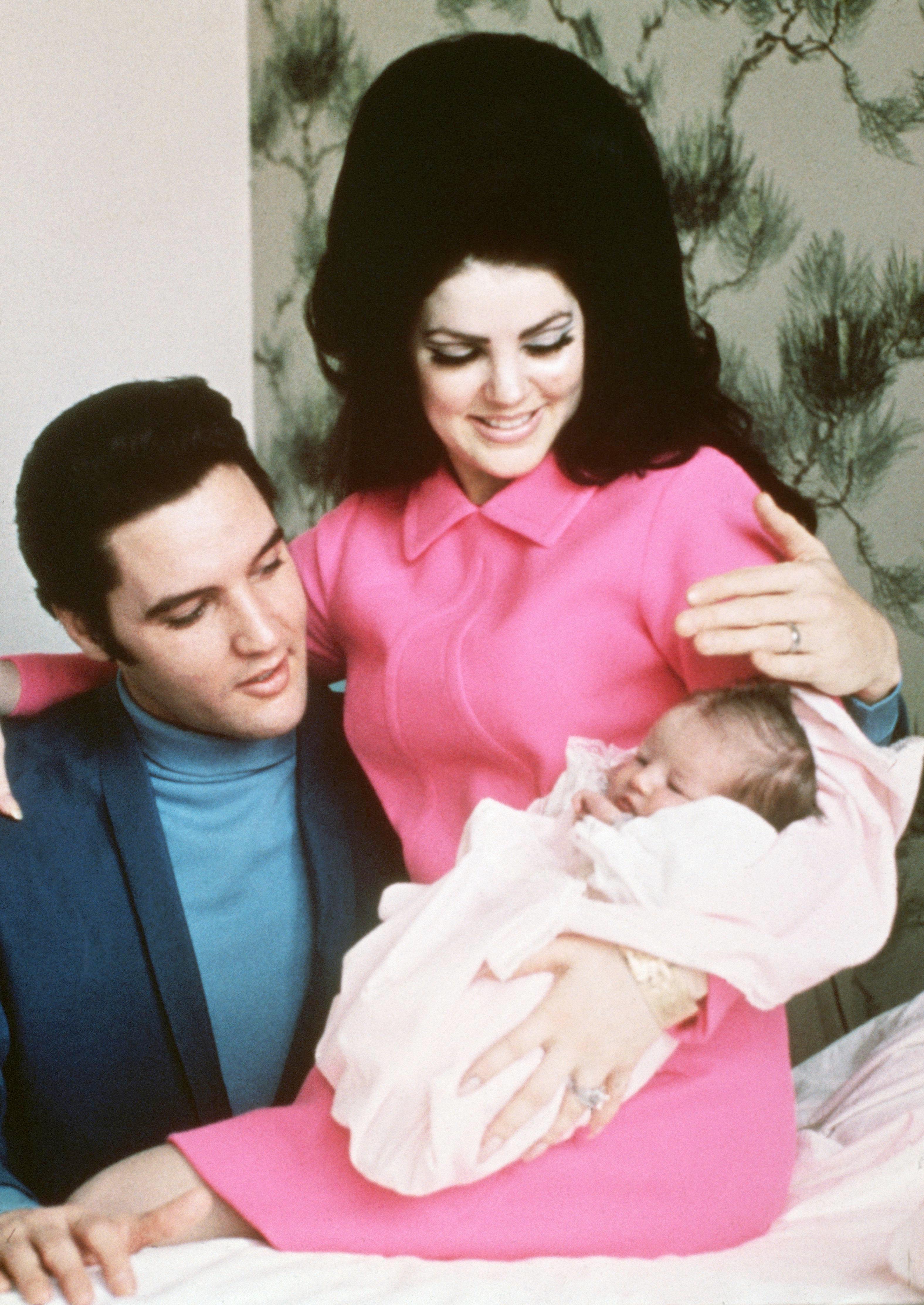 Elvis Presley and his wife Priscilla prepare to leave the hospital with their new daughter Lisa Marie in Memphis, Tennessee, on February 5, 1968