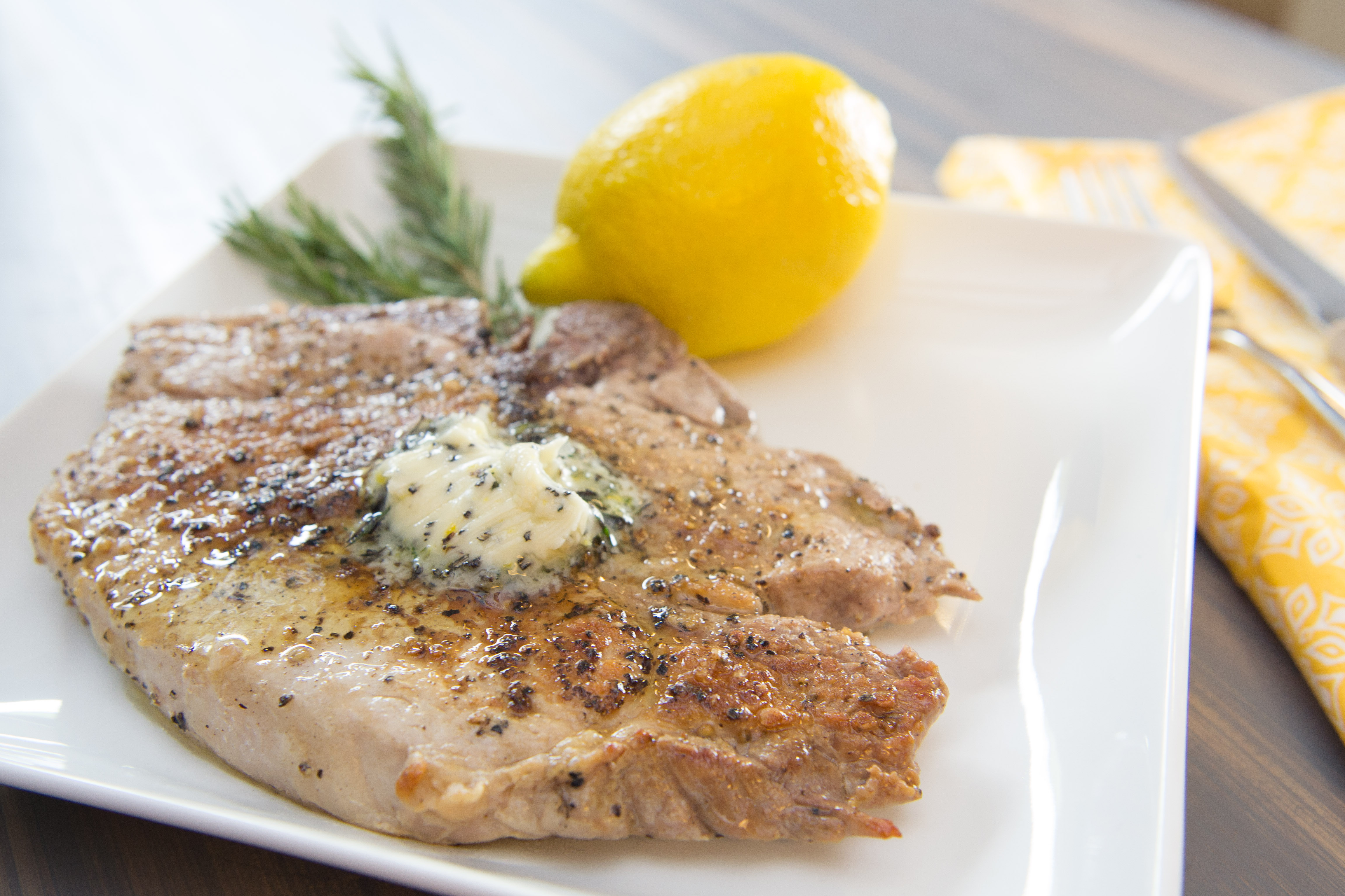 Pork chops with lemon rosemary thyme butter