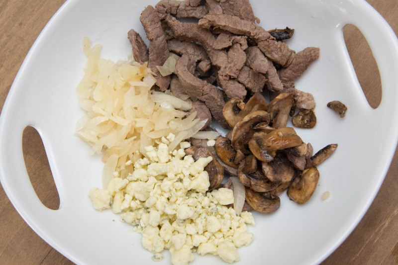 Seasoned steak strips, onions, mushrooms, blue cheese