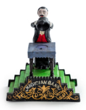 Cast Iron Magician Coin Bank 