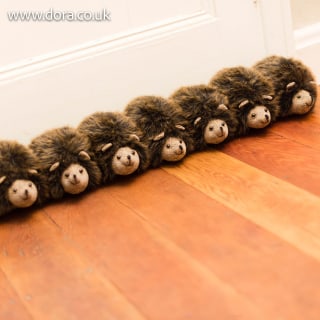 Row of Hedgehogs draft excluder by Dora