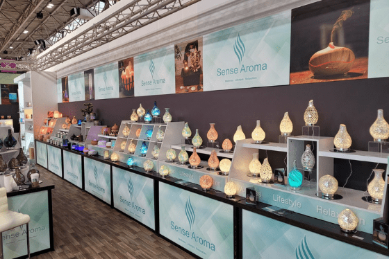 LED LIT ULTRASONIC AROMA DIFFUSERS, BEAUTIFULLY DISPLAYED ON BRANDED STANDS AT THE AUTUMN FAIR TRADE SHOW FOR WHOLESALE CLIENTS IN THE UK READY FOR DISTRIBUTION 