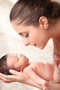 happy mother holding her baby