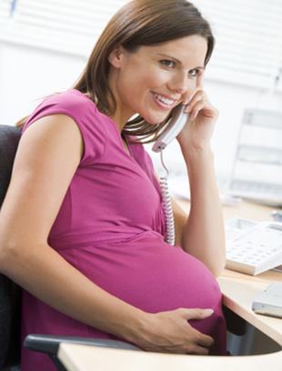 Helen_Brougham_Pregnant_Woman_Sitting_At_Desk