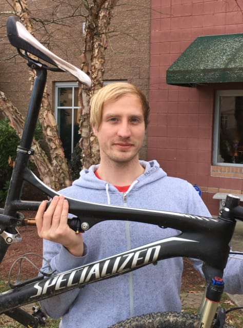 Combining work and play: Collier Research's Bertram, an avid mountain bike rider, with his favorite ride—until a carbon fiber frame offers similar value. (Image supplied by Bertram)