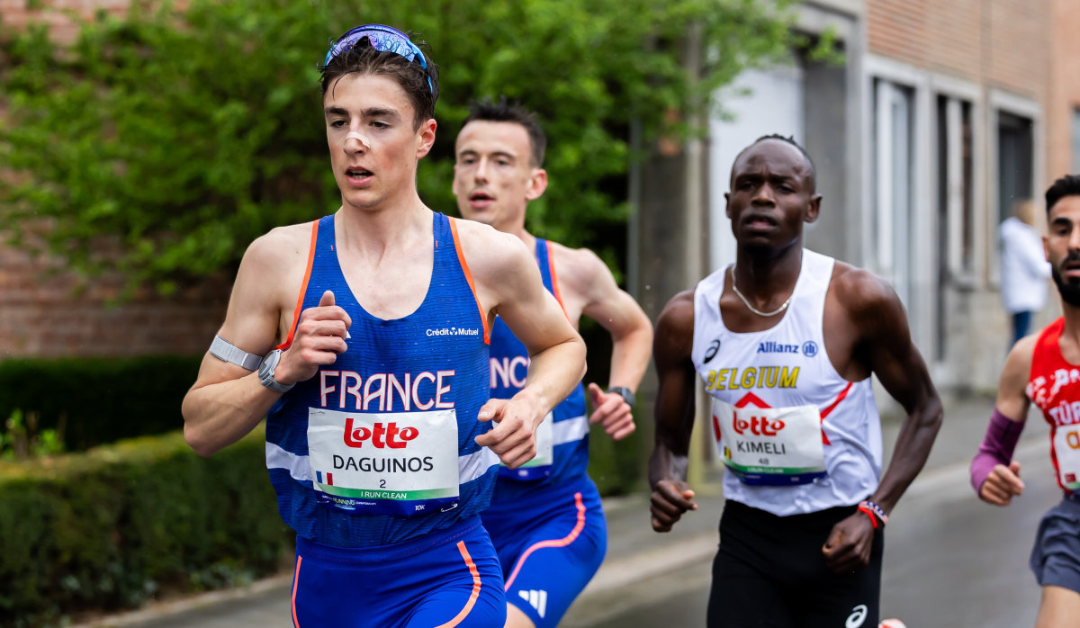 Distance runners competing in half marathon race on fast urban course in Lisbon